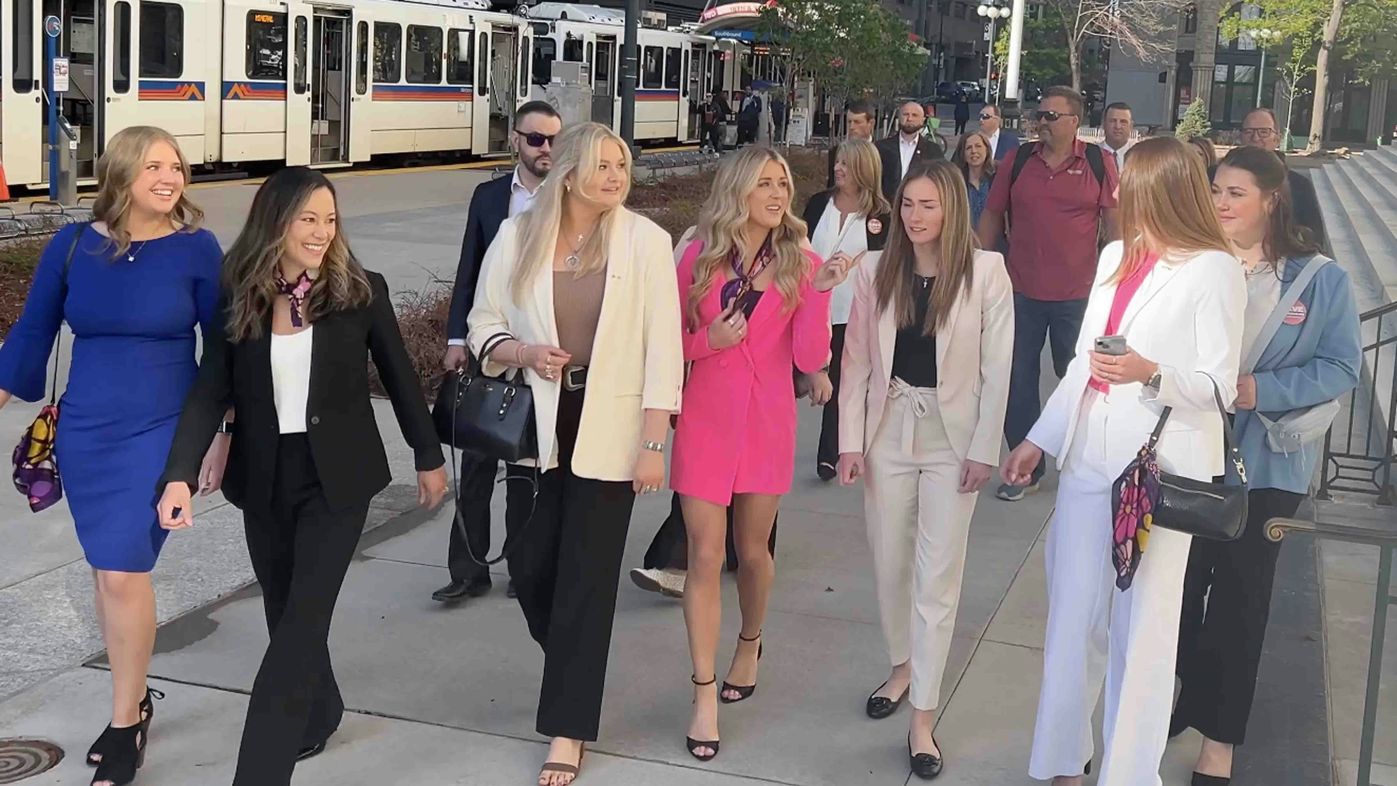 Women's-rights activist Riley Gaines (in pink) walks with UW sorority members to court on Tuesday, May 14, 2024