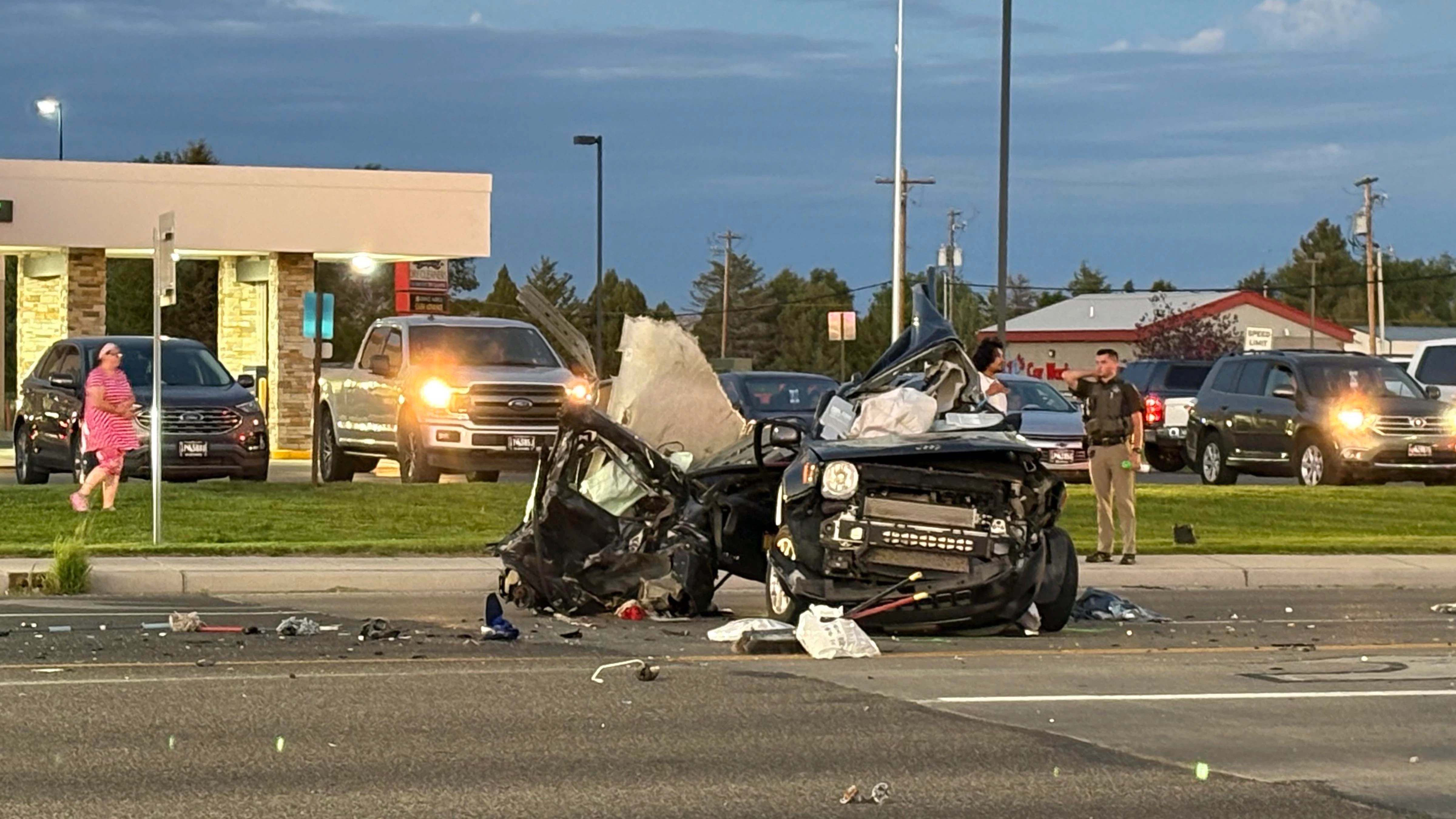 A Dodge pickup involved in a double fatal car crash Wednesday evening lay on its side before wreckers righted it and winched it onto a trailer. The driver of the pickup tried to flee the scene, one witness said