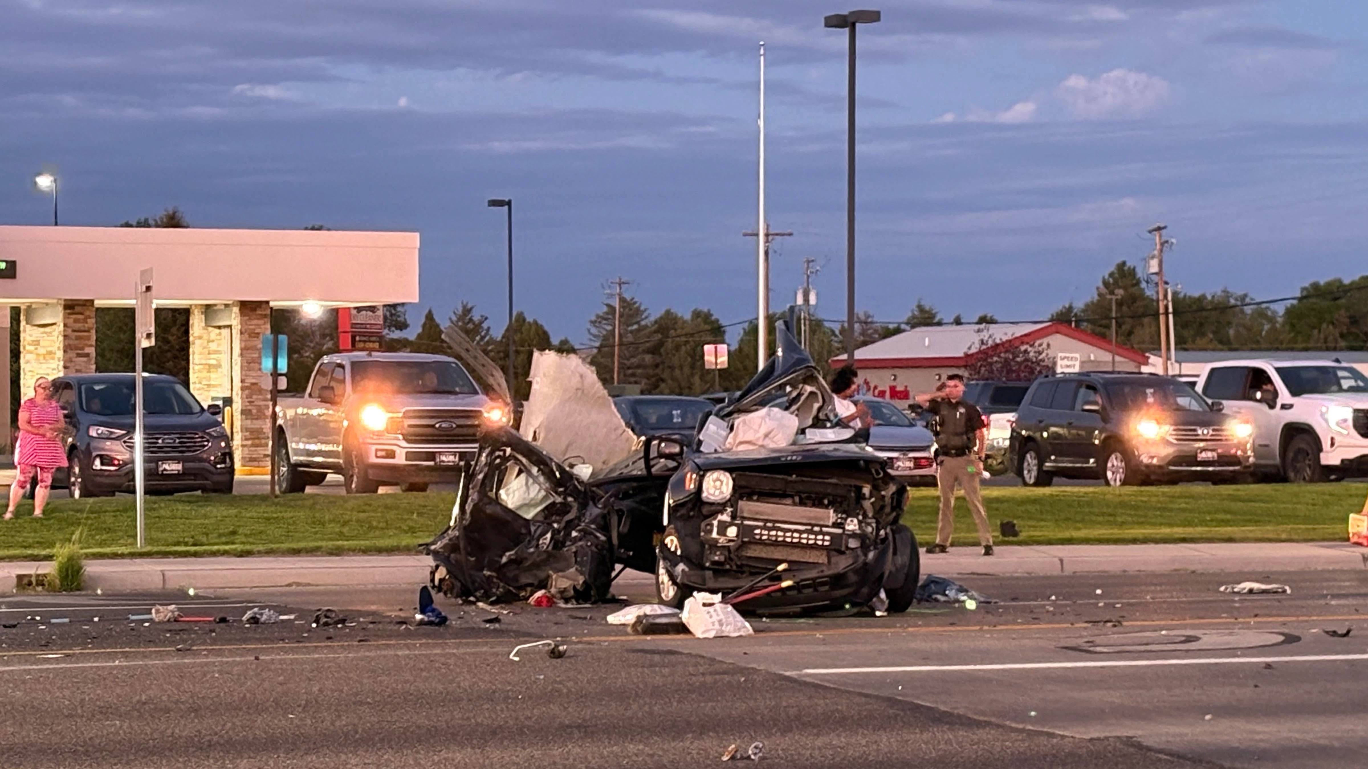 A Dodge pickup involved in a double fatal car crash Wednesday evening lay on its side before wreckers righted it and winched it onto a trailer. The driver of the pickup tried to flee the scene, one witness said
