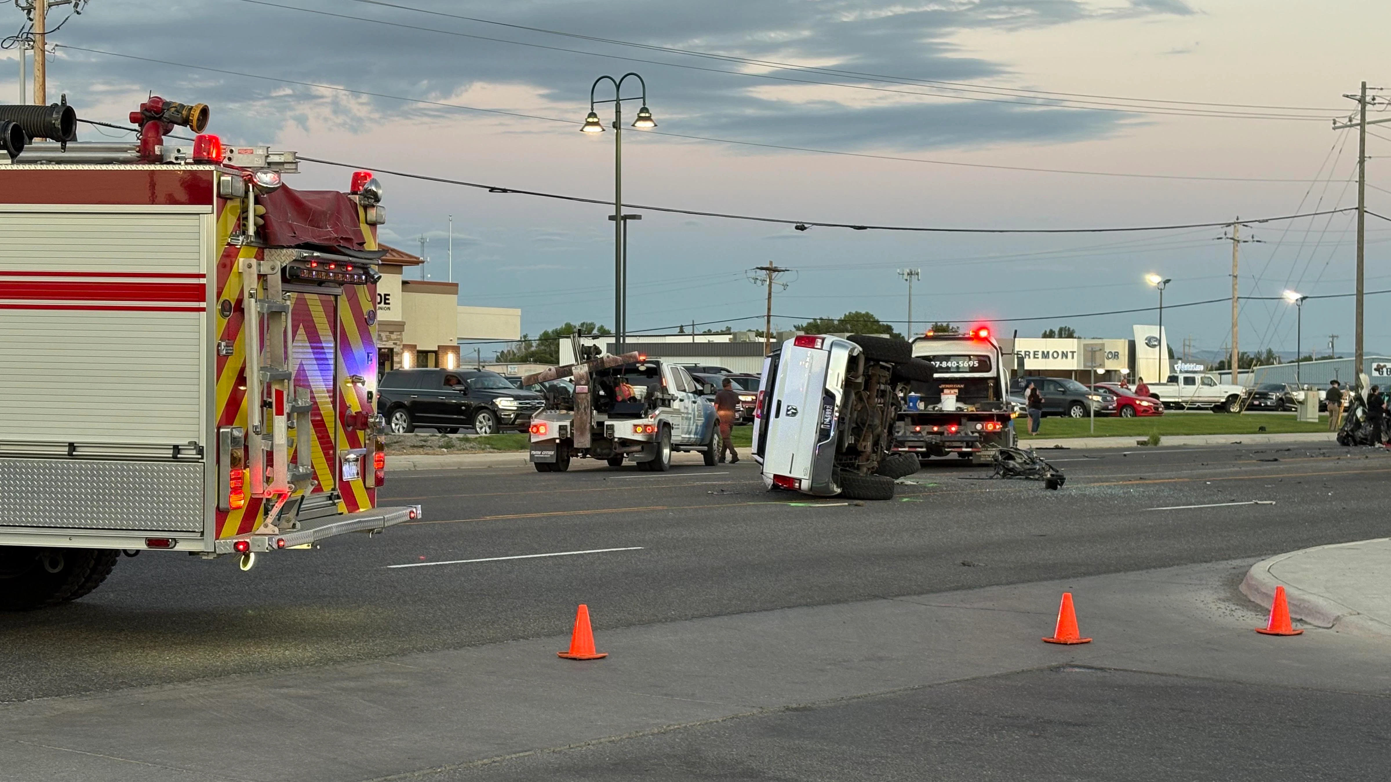 A Dodge pickup involved in a double fatal car crash Wednesday evening lay on its side before wreckers righted it and winched it onto a trailer. The driver of the pickup tried to flee the scene, one witness said