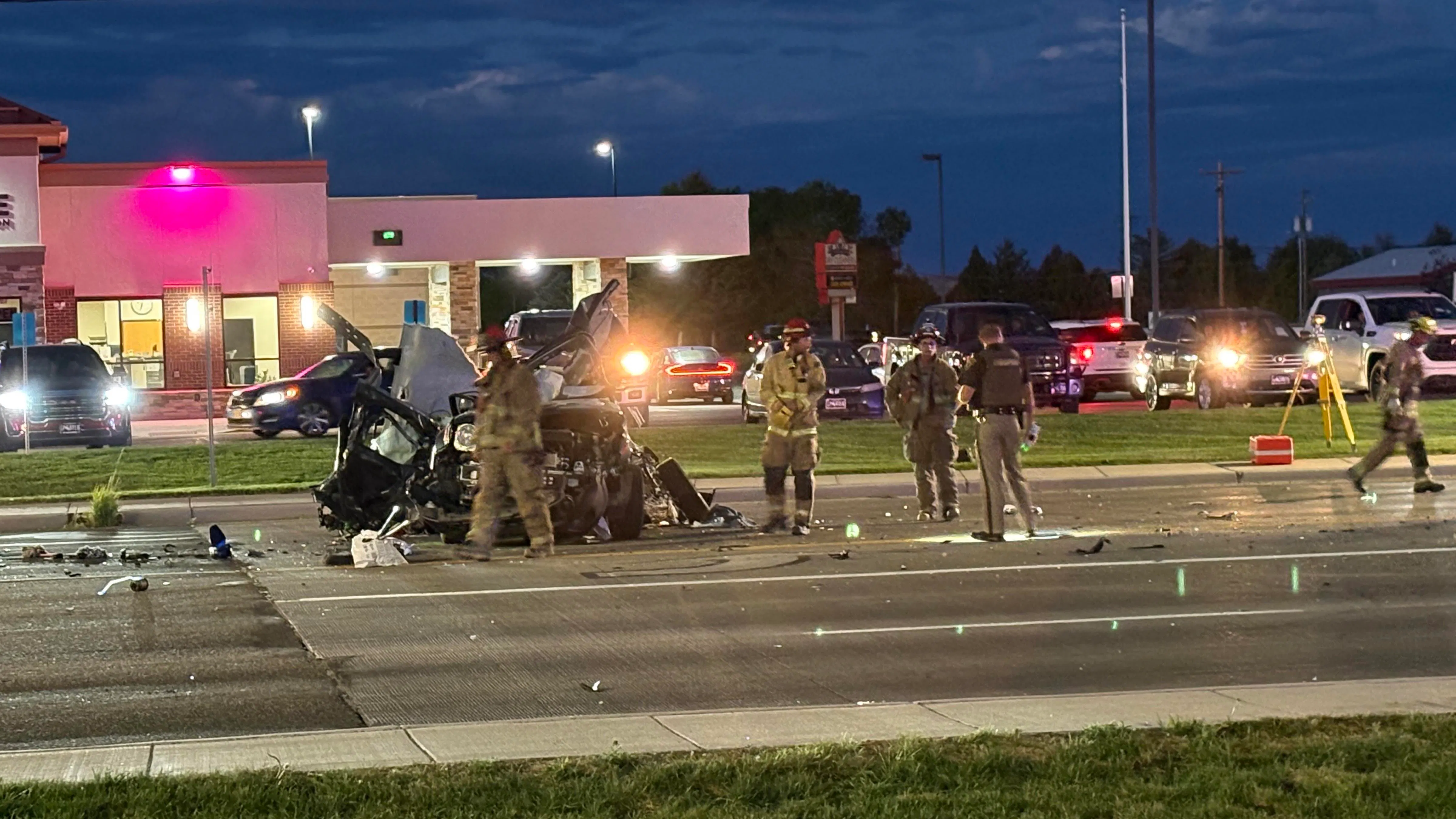 A Dodge pickup involved in a double fatal car crash Wednesday evening lay on its side before wreckers righted it and winched it onto a trailer. The driver of the pickup tried to flee the scene, one witness said