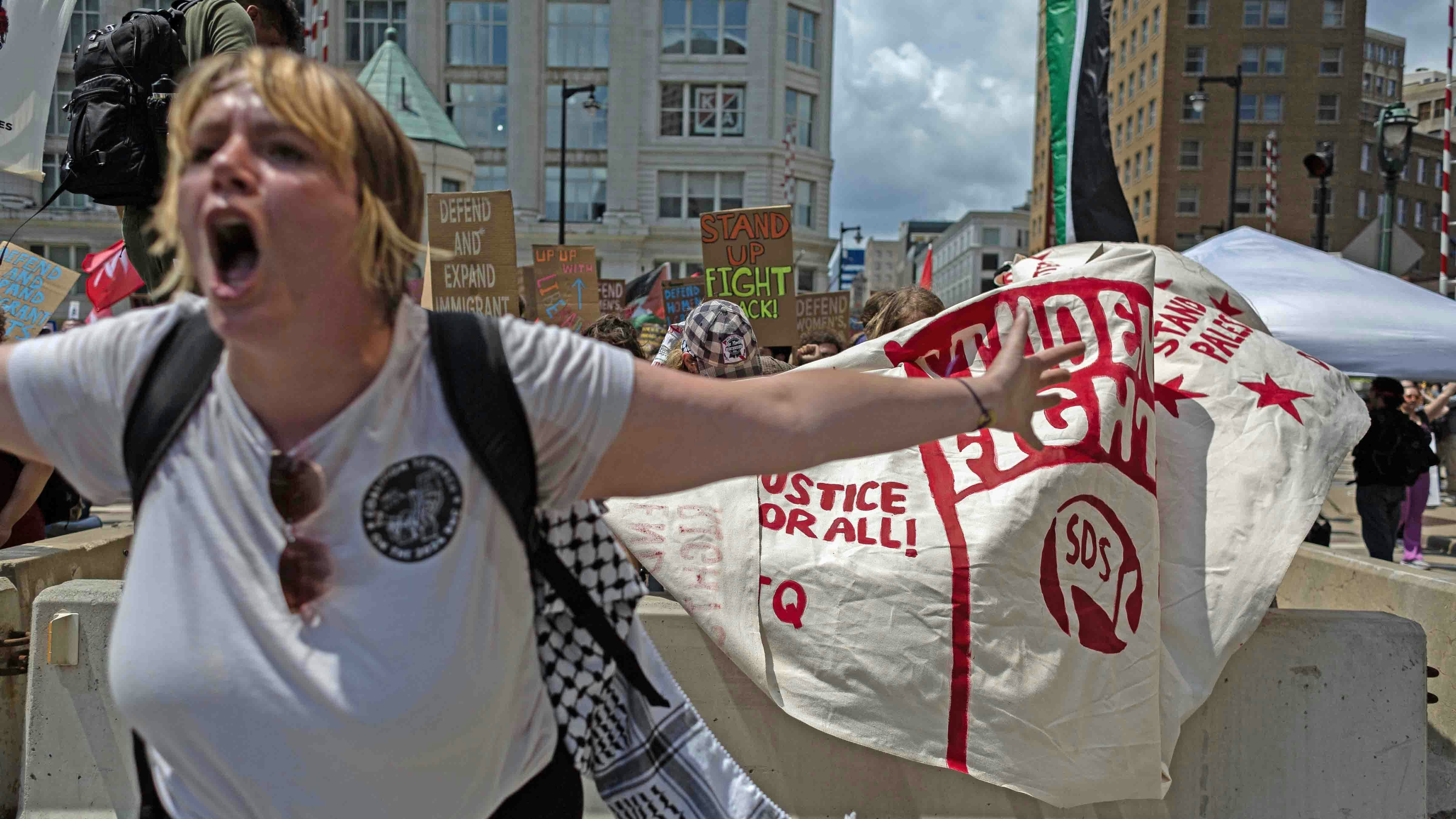 Pro-Palestine and other protesters march through the streets of downtown Milwaukee as the Republican National Convention begins on July 15, 2024 in Milwaukee, Wisconsin.