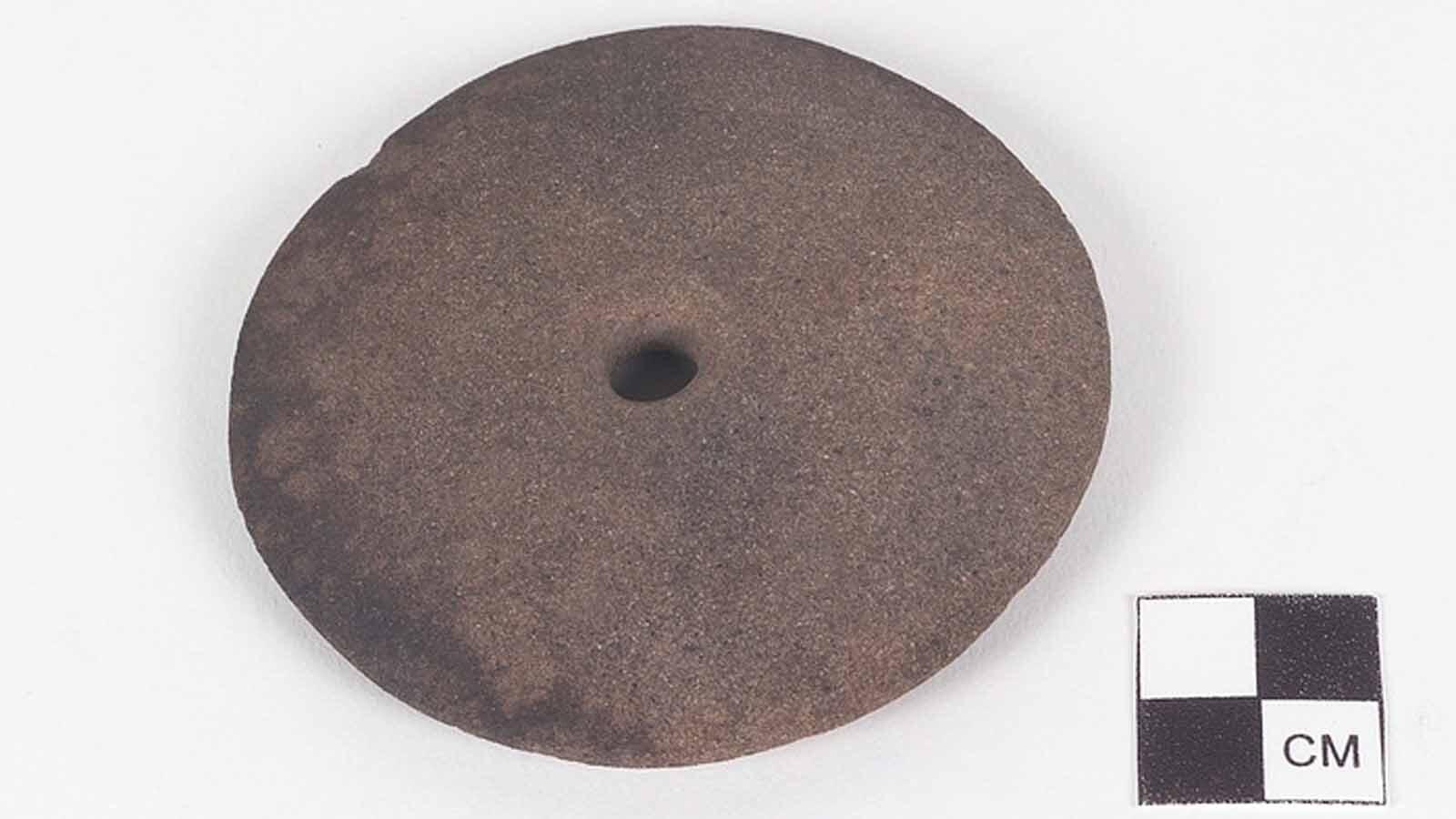 The National Museum of the American Indian has an example of the spindle whorl on display. They are more commonly found in the southwest but were also brought into Wyoming to make cordage out of sagebrush and other plants.