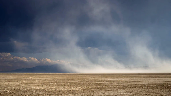 A shrinking Great Salt Lake is exposing hundreds of square miles of lakebed to the wind, raising concerns among Utah scientists that dust carrying potentially harmful materials could spread into neighboring states, including southwestern Wyoming.