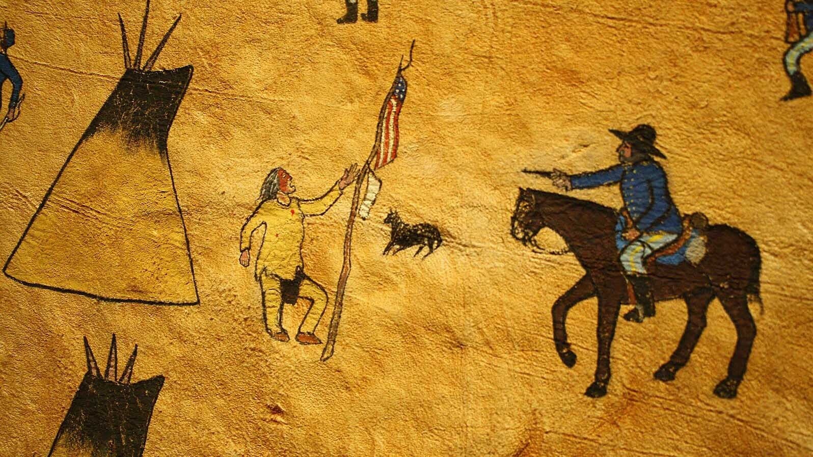 The photo is a piece of a painting on an elk hide showing Black Kettle with the American Flag and the military attack at Sand Creek. The hide was painted by Northern Arapaho Benjamin Ridgely Sr. The original is on display at the Northern Arapaho Experience Room in the Wind River Hotel and Casino just west of Riverton.