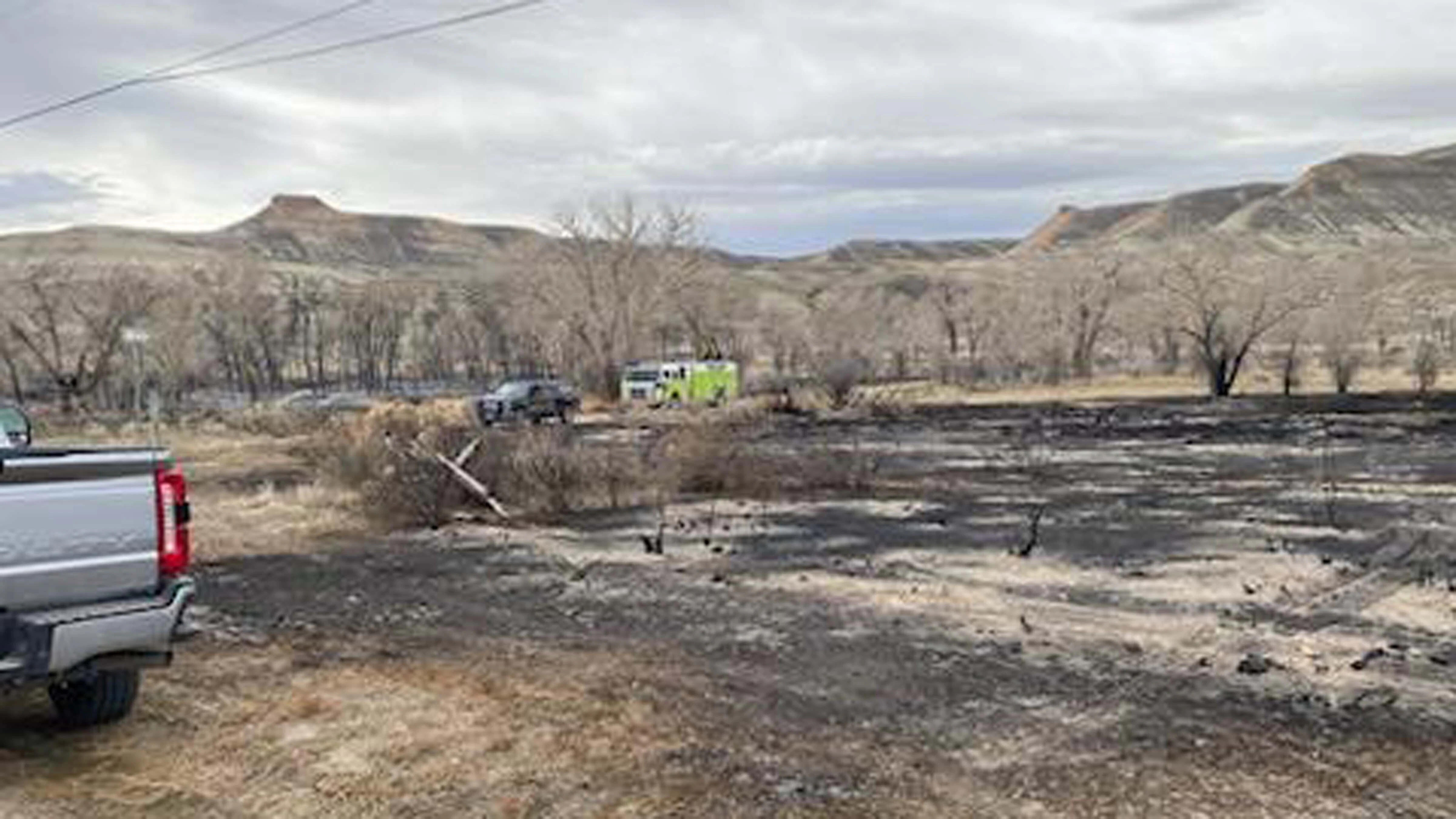 Green River Fire Dept putting out hot spots on Monday at the Scotts Bottom Fire
