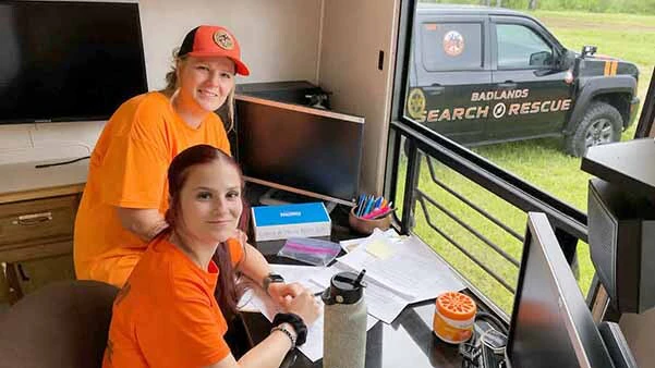 Karly Brennan and her daughter, Kaylee, help manage the logistics of a missing person search for Badlands Search and Rescue in North Dakota.