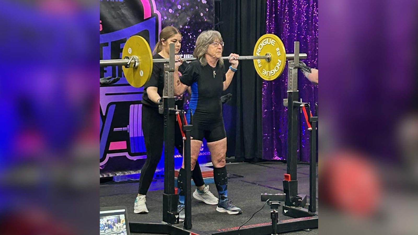Suzanne Luhr squats during the United Ladies of Iron Competition in Evanston in May 2025.
