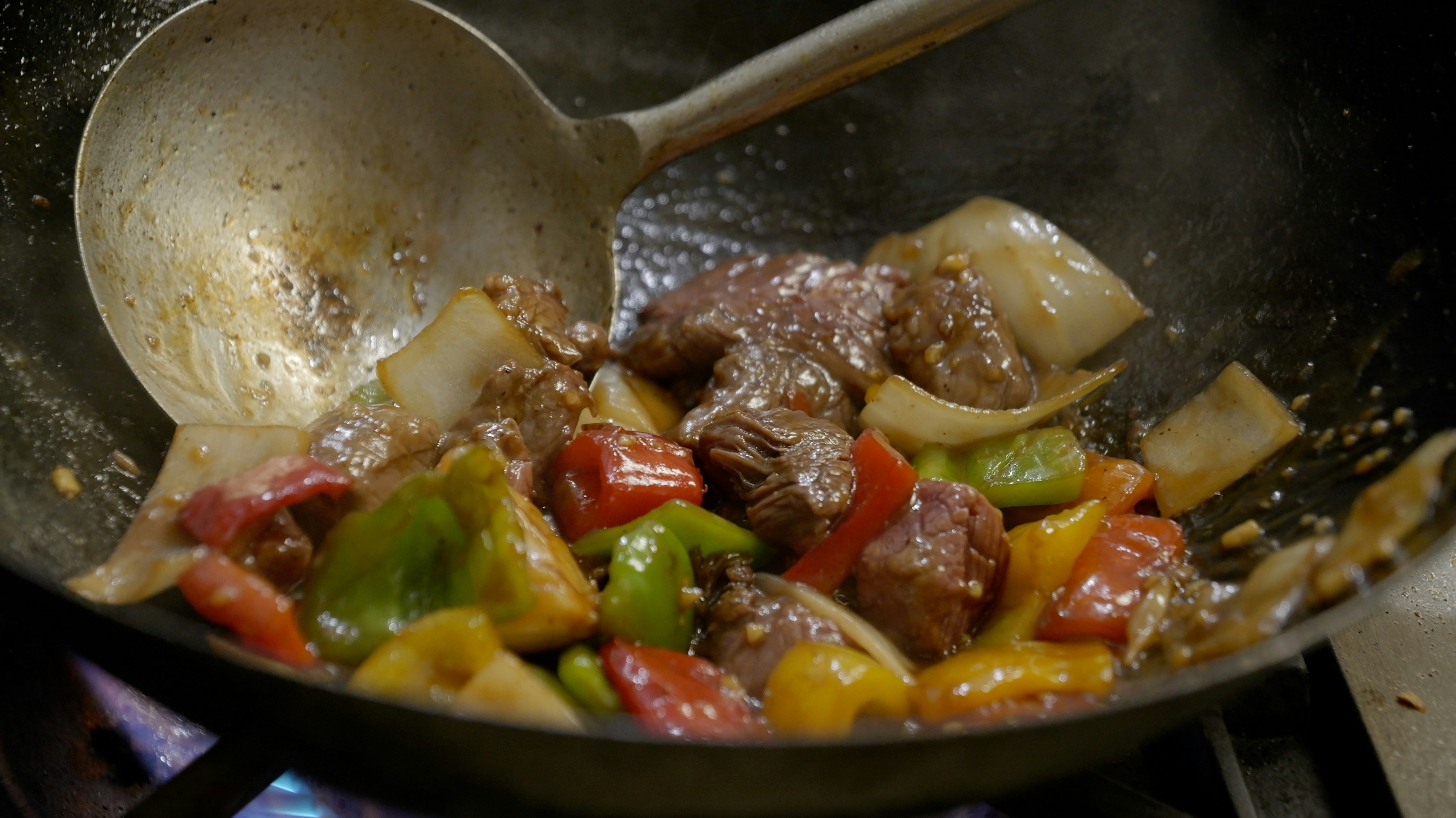 One of the V Cafe's signature dishes called shaking beef. It's served on a sizzling platter.