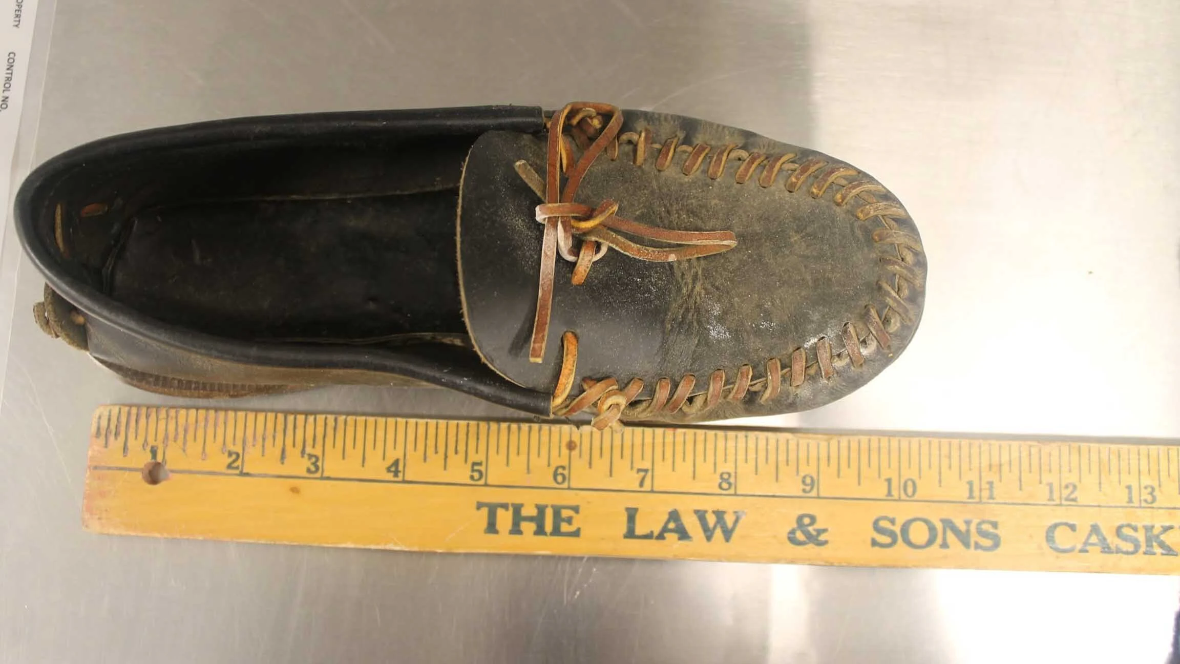 Leather moccasins were among the items found on the bank of the Greybull River near where an unidentified young man's body was discovered in 1973.