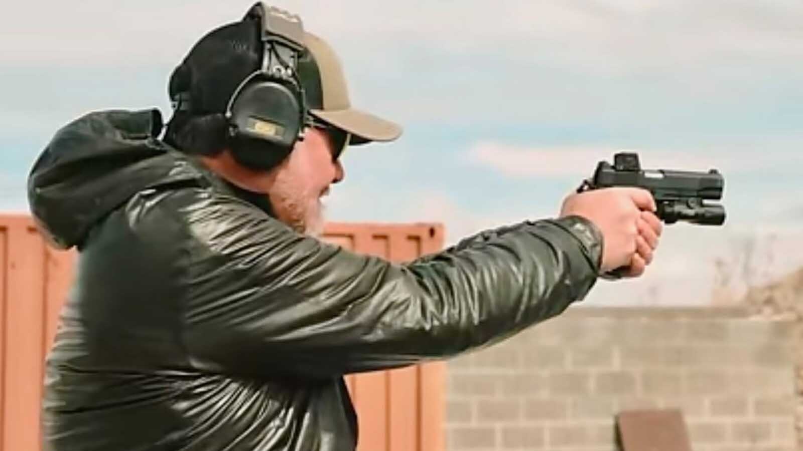 Firearms instructor Jason Crotteau shoots an SDS Tisas 2011 pistol. The 2011 pistol design is gaining popularity with recreational and competitive target shooters, and might help reinvigorate slumping firearms sales.