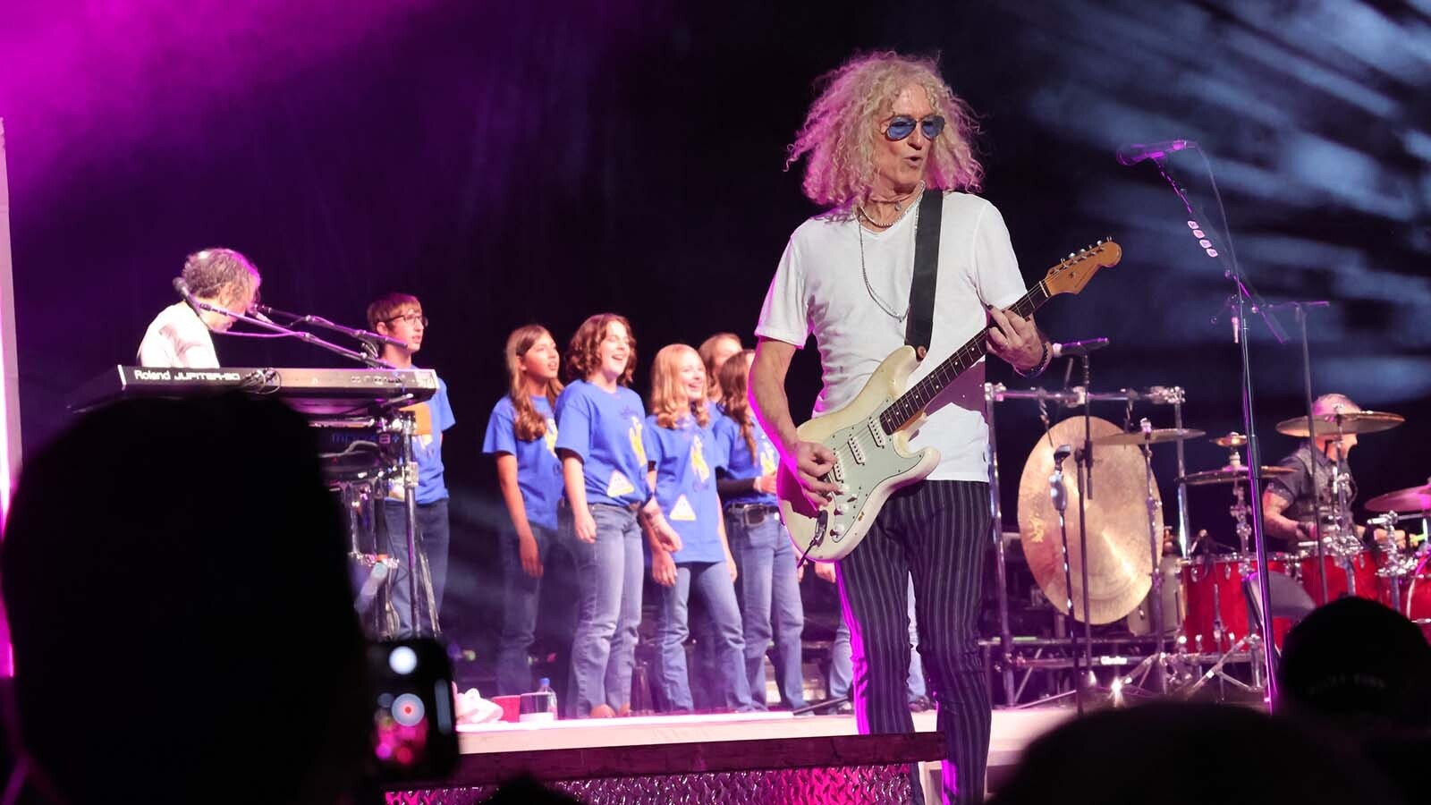 The Shoshoni High School choir played the role of backup singers for the band Foreigner on Tuesday at Ford Wyoming Center in Casper.