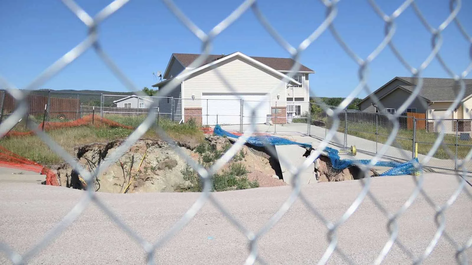 Six years after a huge sinkhole opened up in a subdivision near Black Hawk, South Dakota, victims still waiting for relief. The disaster highlights the difference between Wyoming’s abandoned mine safeguards and South Dakota’s limited protections.