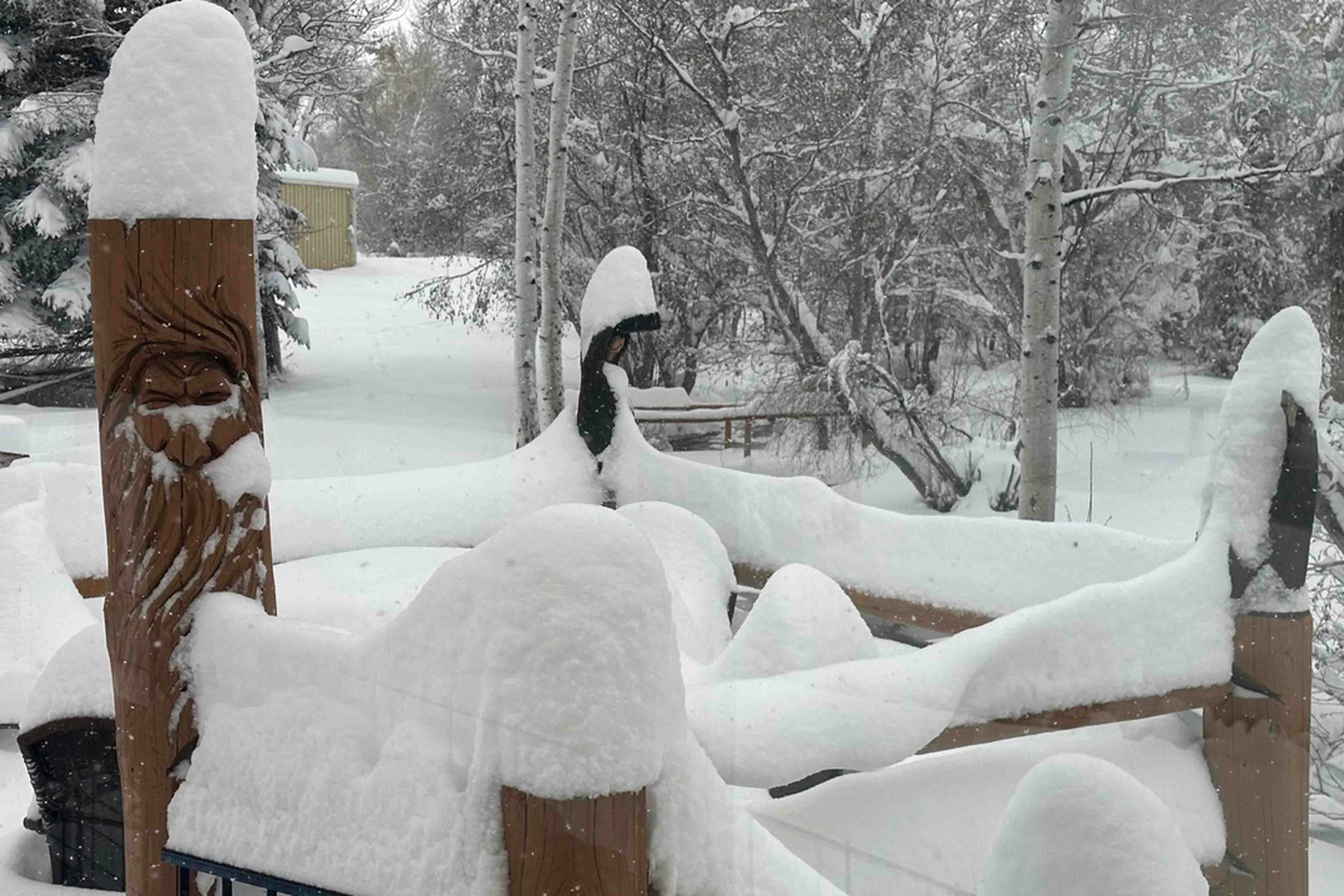 The wind does not blow much in Lander. Here is the snow piling up on the back deck at the Sniffin home.