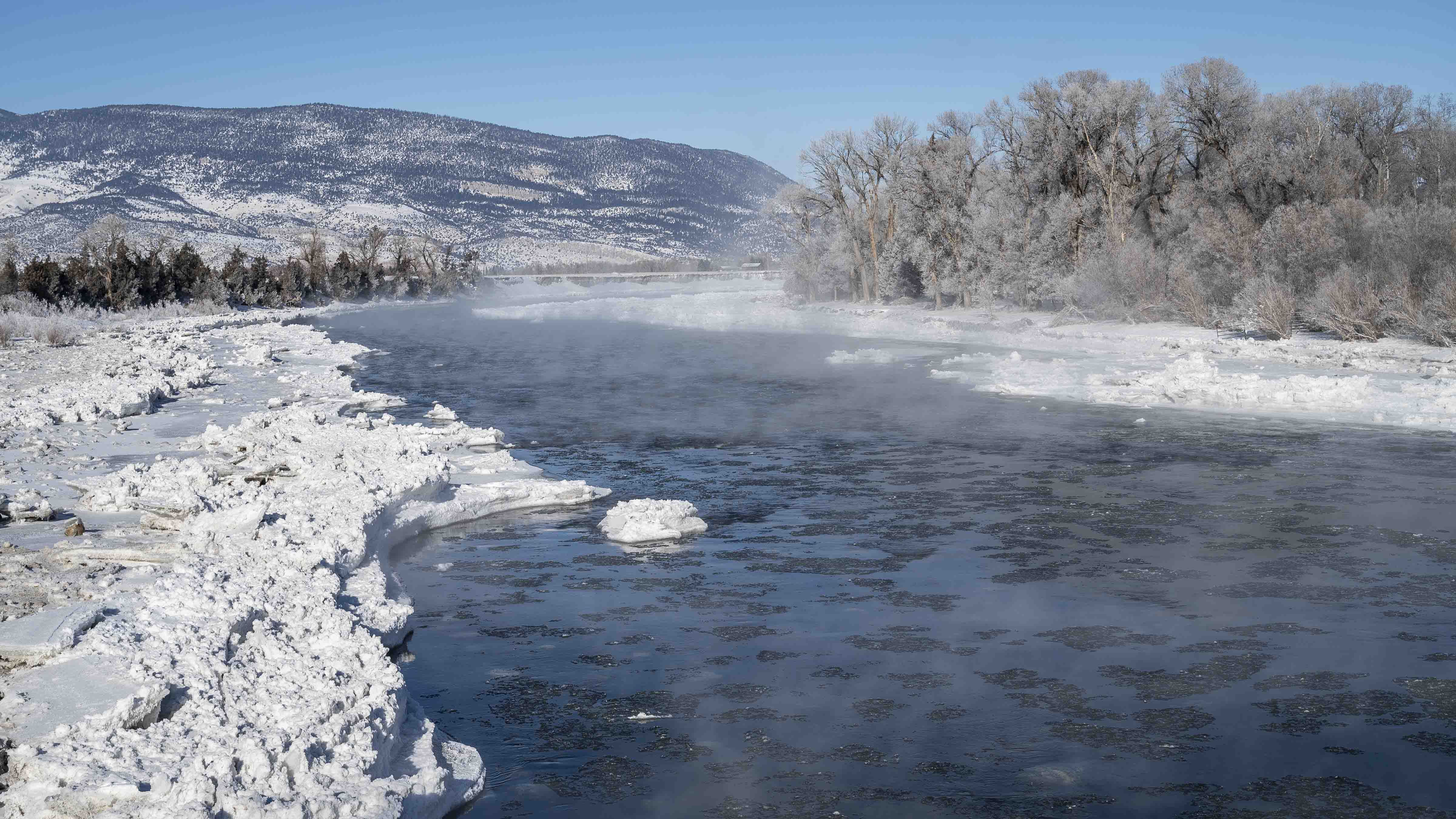 Mist rises above ice floes on the Yellowstone River