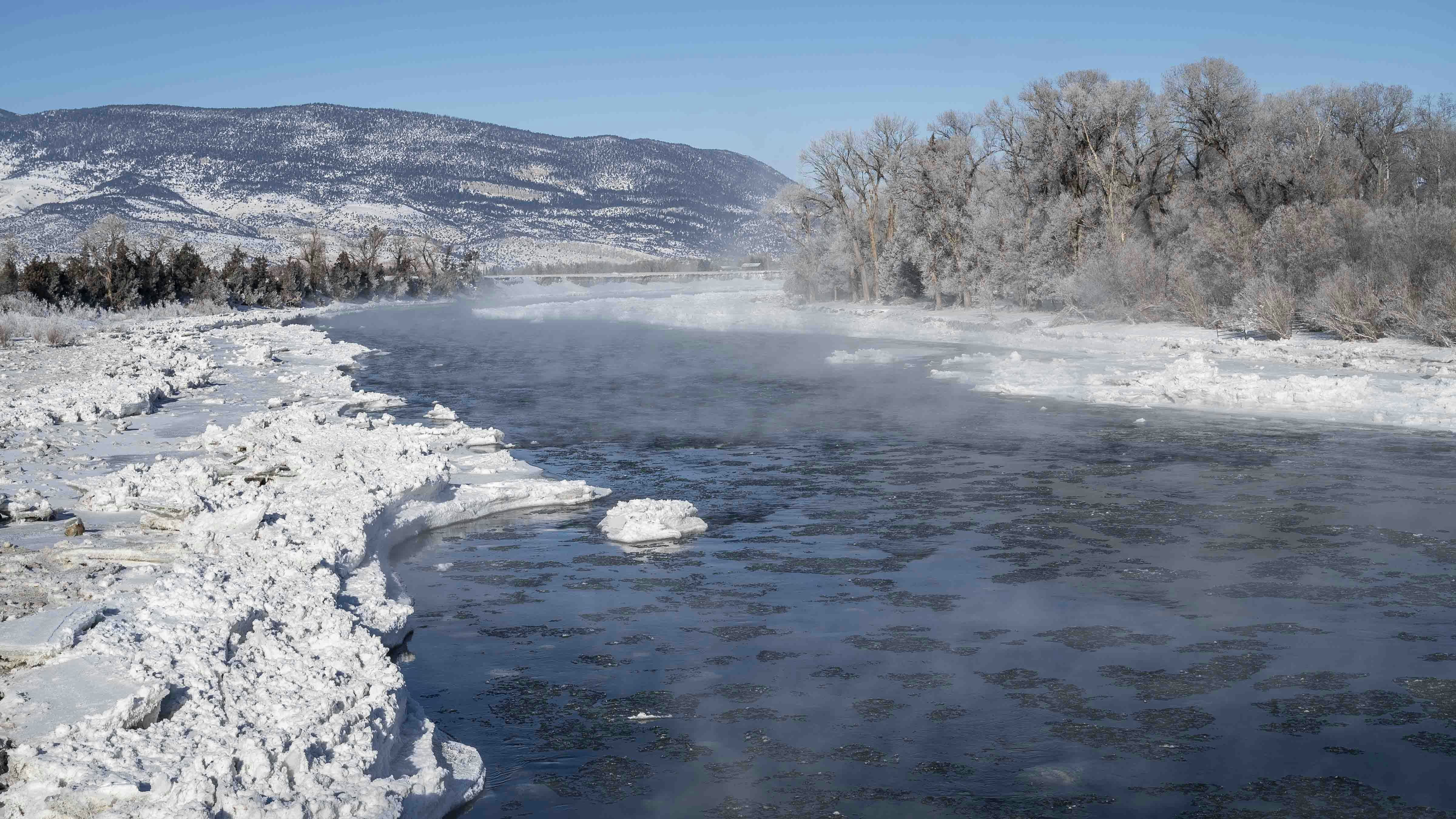 Mist rises above ice floes on the Yellowstone River