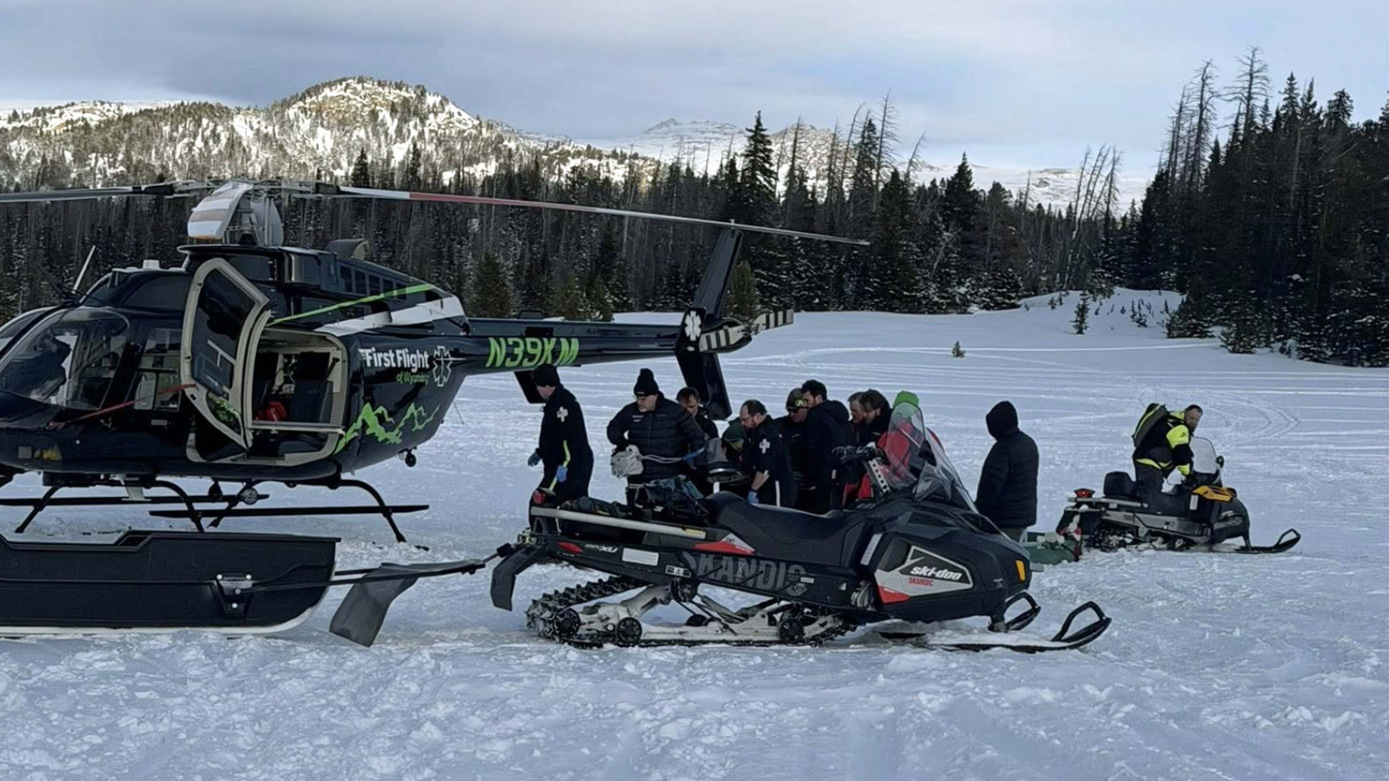 A Russian snowmobiler fell 15 feet off a bridge near the Wyoming-Montana line and was badly hurt. Nearby rescue teams training close by airlifted him quickly, saving his life.