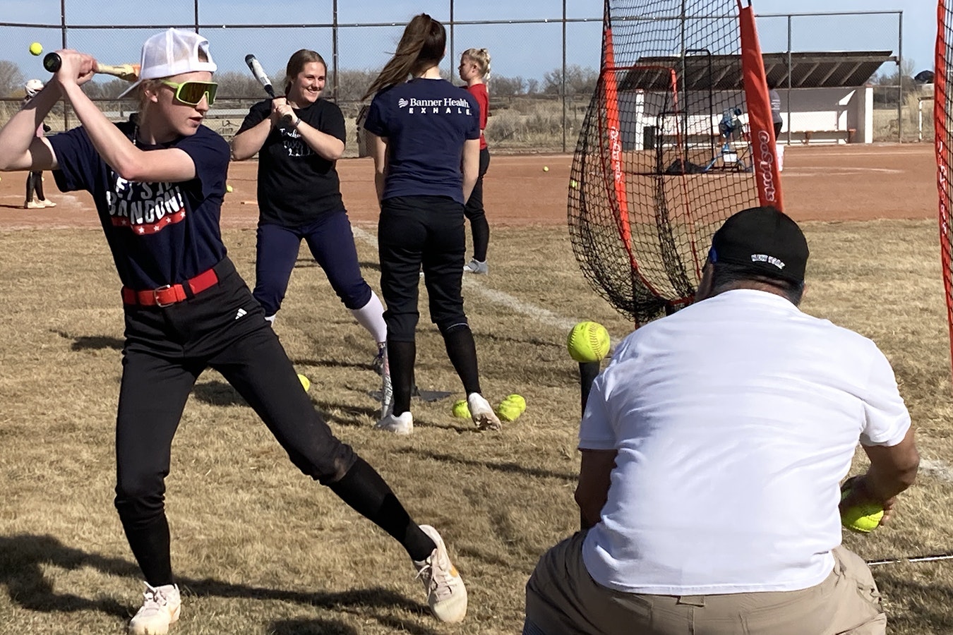 Riverton High School senior Cassy Miller practices Monday with the World High girls softball team. Miller and 12 other players from Riverton, Shoshoni and Lander travel three hours every day to be part of the team
