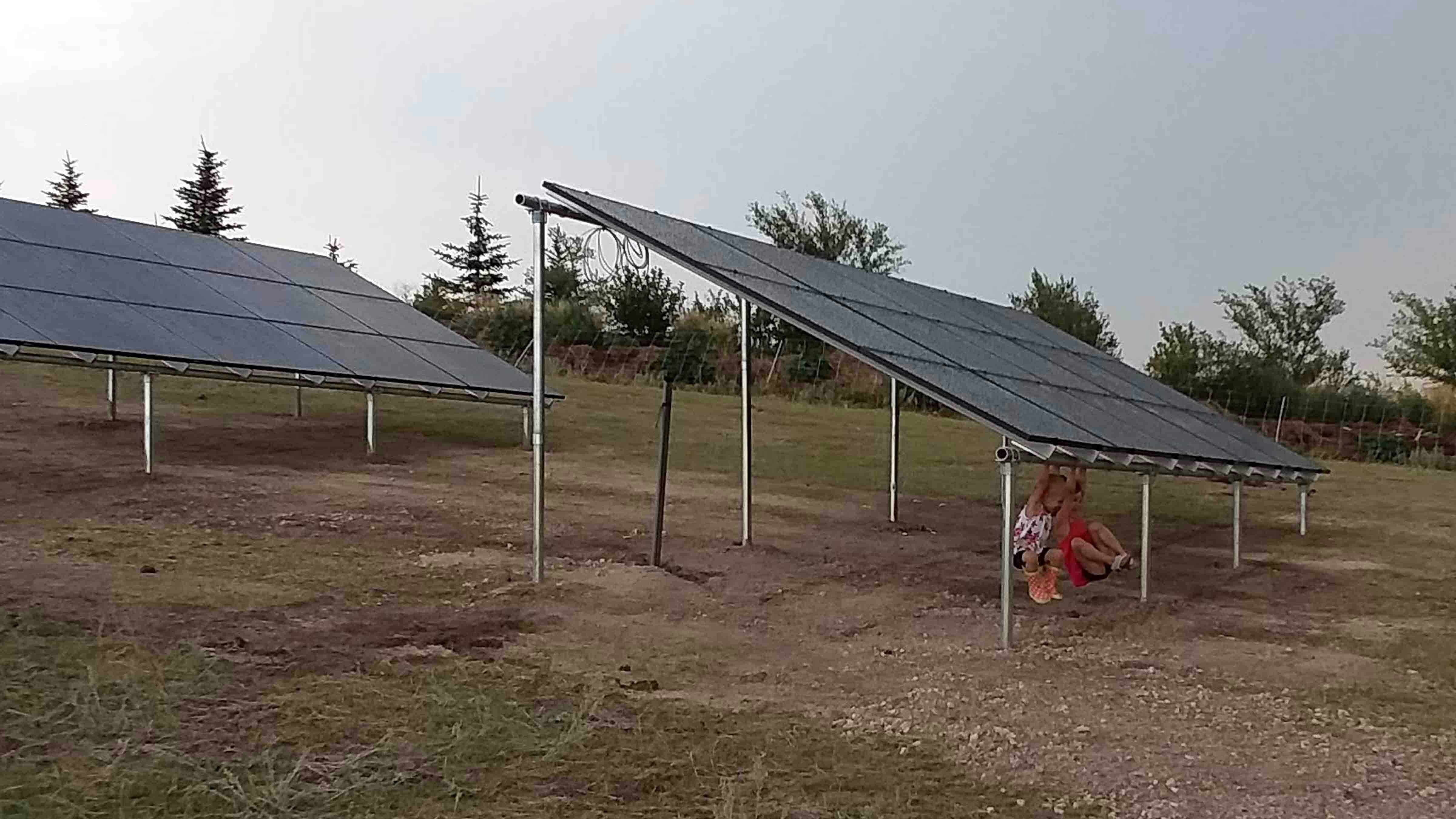 The Meadowcroft children play underneat one of the family's solar panels