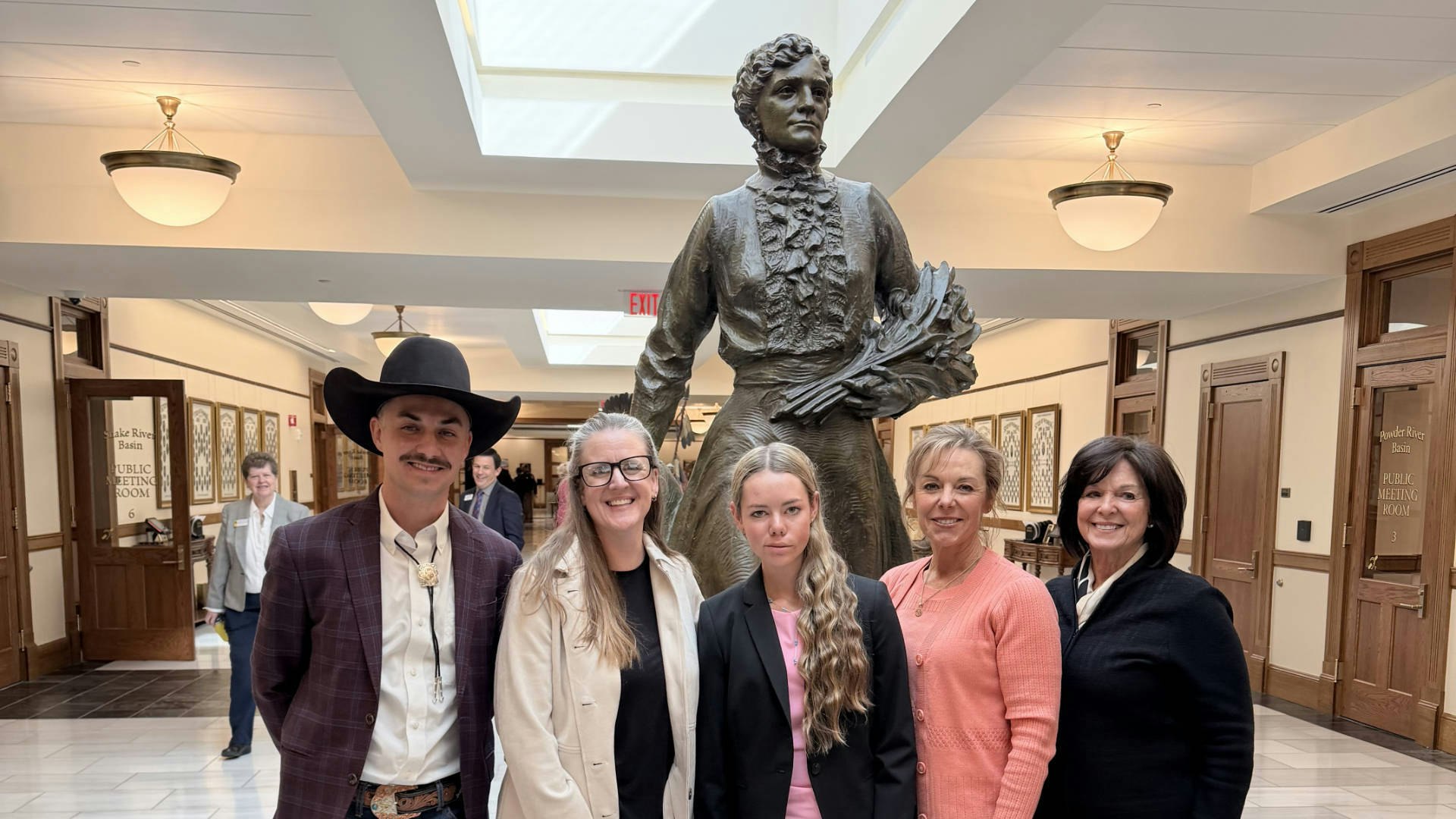 Andrew Joannides (from left to right), Beth Blackwell, Hallee Crozier, Jonee Crozier and Mantha Phillips celebrate on Feb. 25 at the Wyoming Capitol after the Stem Cell Freedom Act was unanimously passed by the House, Labor and Social Services Committee.