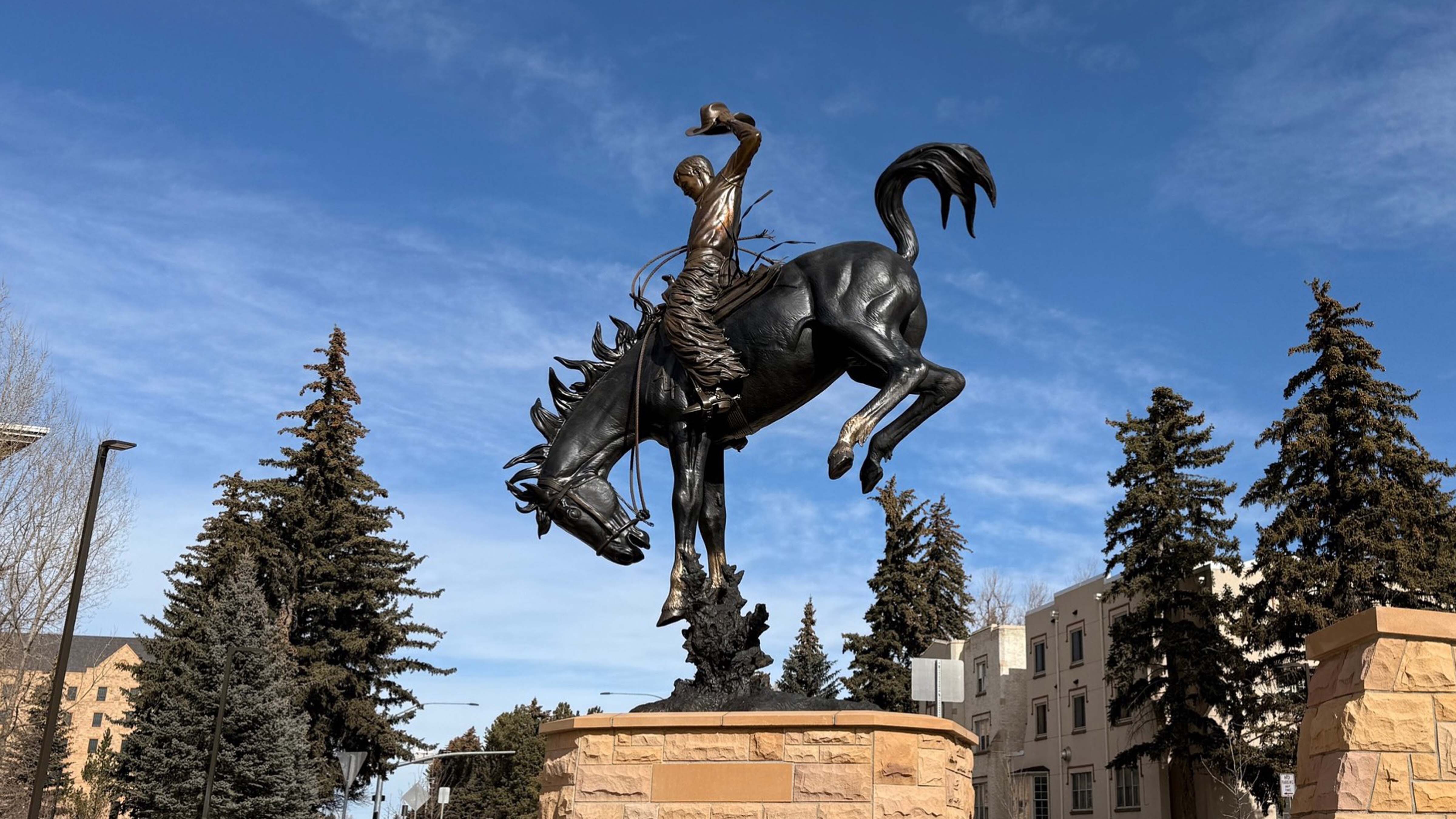 “A Deep Seat and a Long Rein” is a 15.5-foot-tall monument that stands in the new roundabout at Ivinson Avenue and 15th Street on the University of Wyoming campus in Laramie.