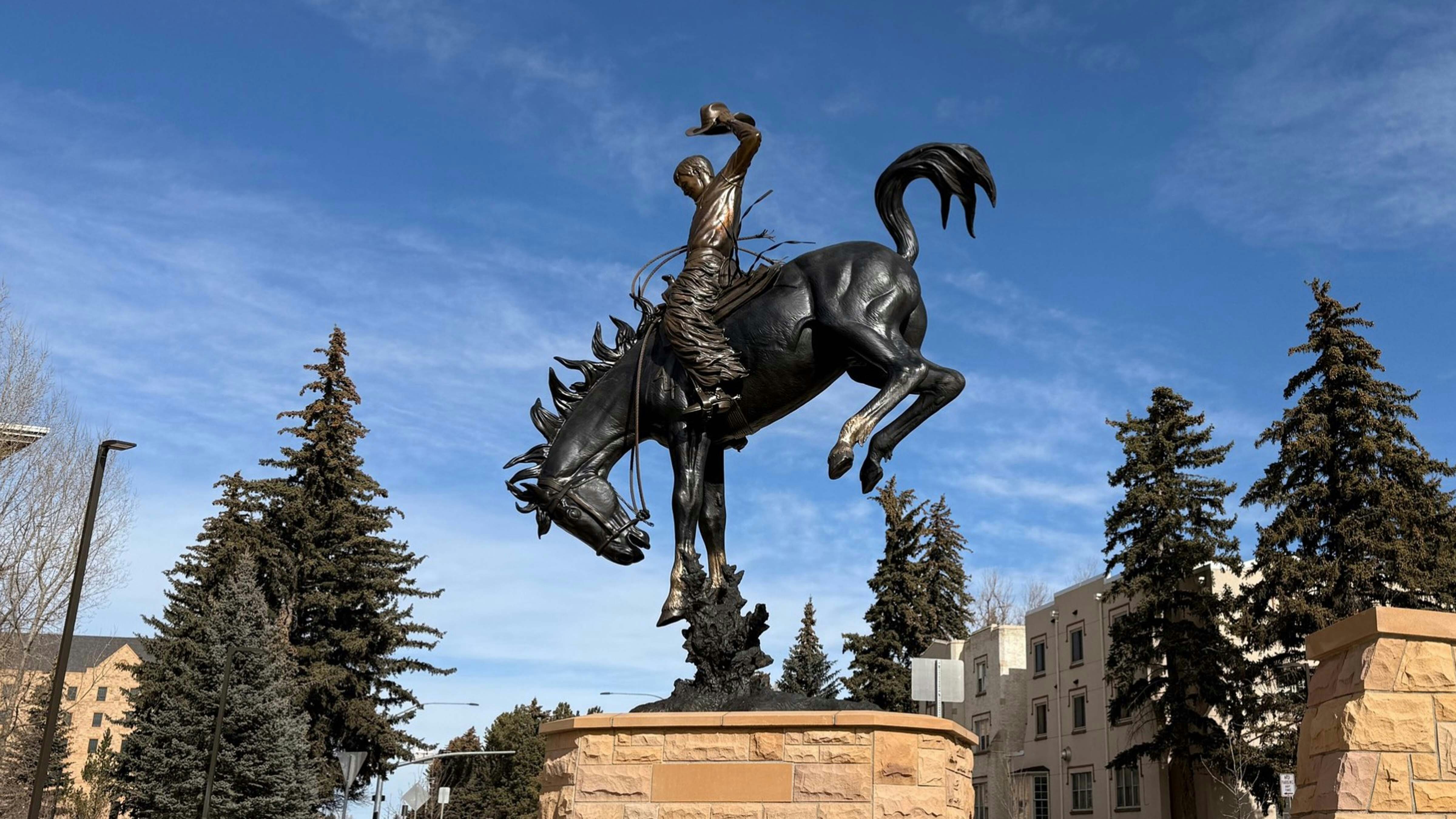 “A Deep Seat and a Long Rein” is a 15.5-foot-tall monument that stands in the new roundabout at Ivinson Avenue and 15th Street on the University of Wyoming campus in Laramie.