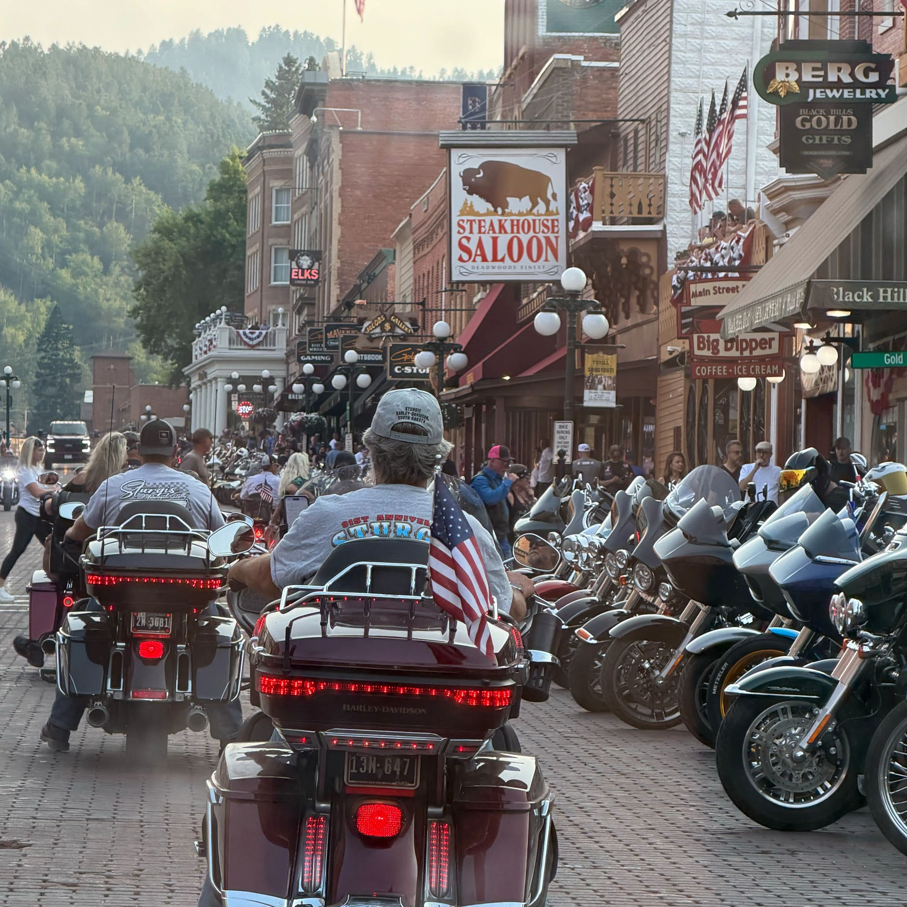 Motorcycles and rallygoers pack the streets in Deadwood as bikers pour into the Black Hills for the Sturgis Motorcycle Rally.