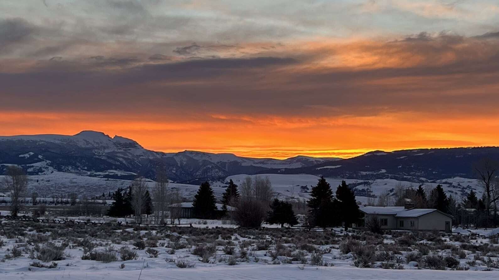 "Beautiful sunrise looking out over Sleeping Indian in Jackson. The view never gets old. Blessed."