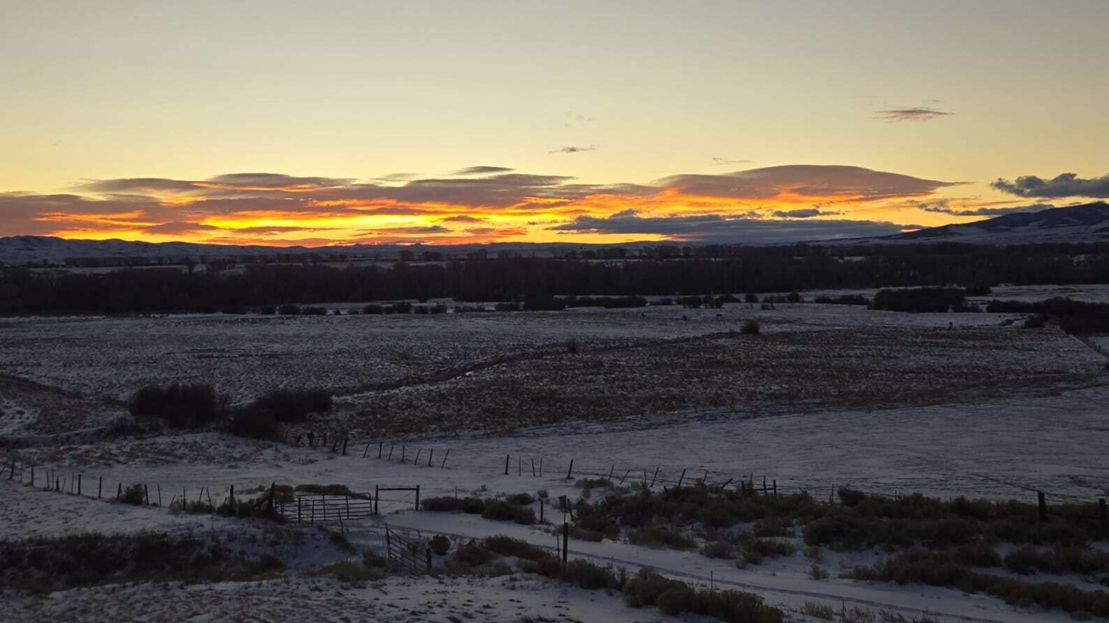 "I live in Denver and my boyfriend, David, lives in Casper and we meet here often to hunt, hike and soak in Saratoga hobo pools.  When you see a sunrise such as this, spanning the entire horizon, you believe the day holds infinite blessings and possibilities."