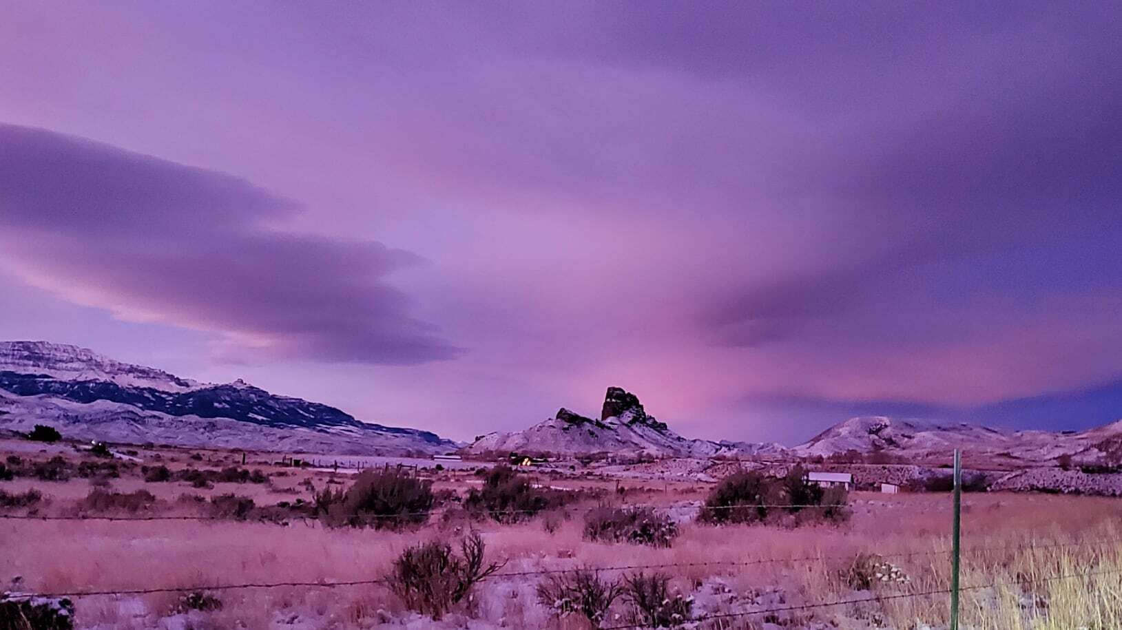 "A little Alpenglow with the sunrise. Castle Rock."