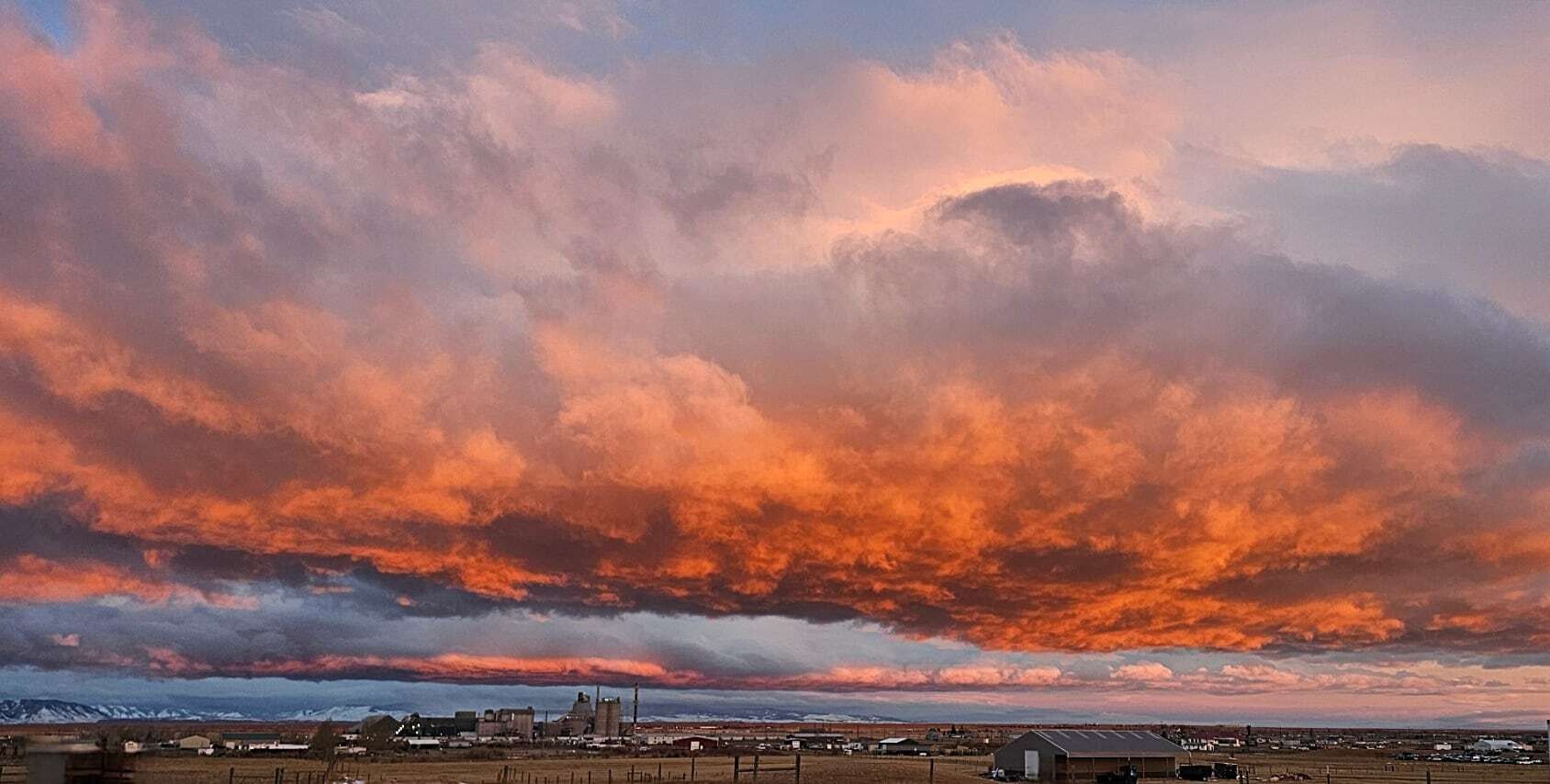 "Love how the colors accent the different types of clouds. Taken from south of Laramie looking towards the Snowy Range Mountains."