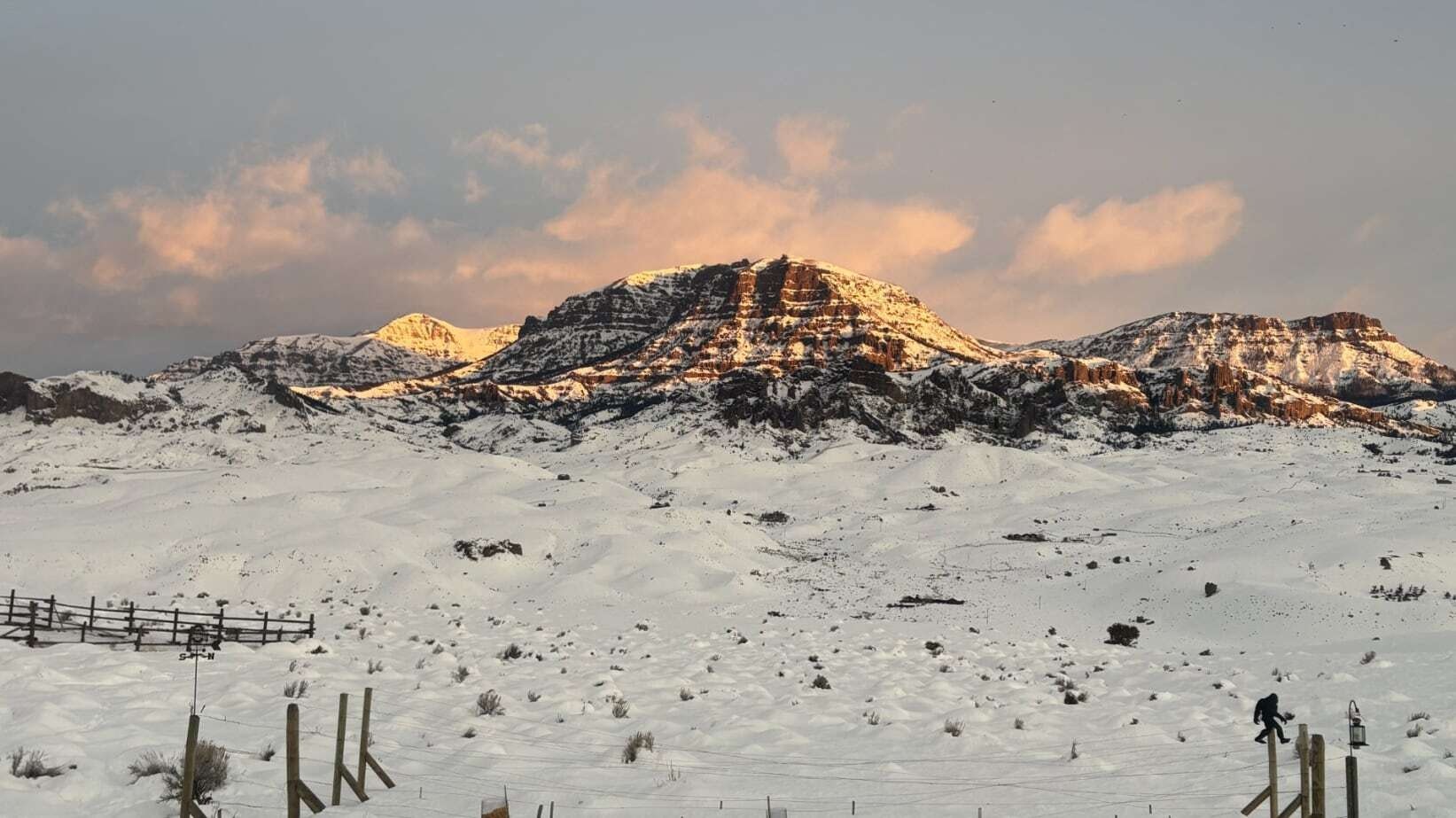 "Jim Mountain in Wapiti Valley, recently covered by 27 inches of snow, is warmed by sunrise, which hasn’t been seen in several days."