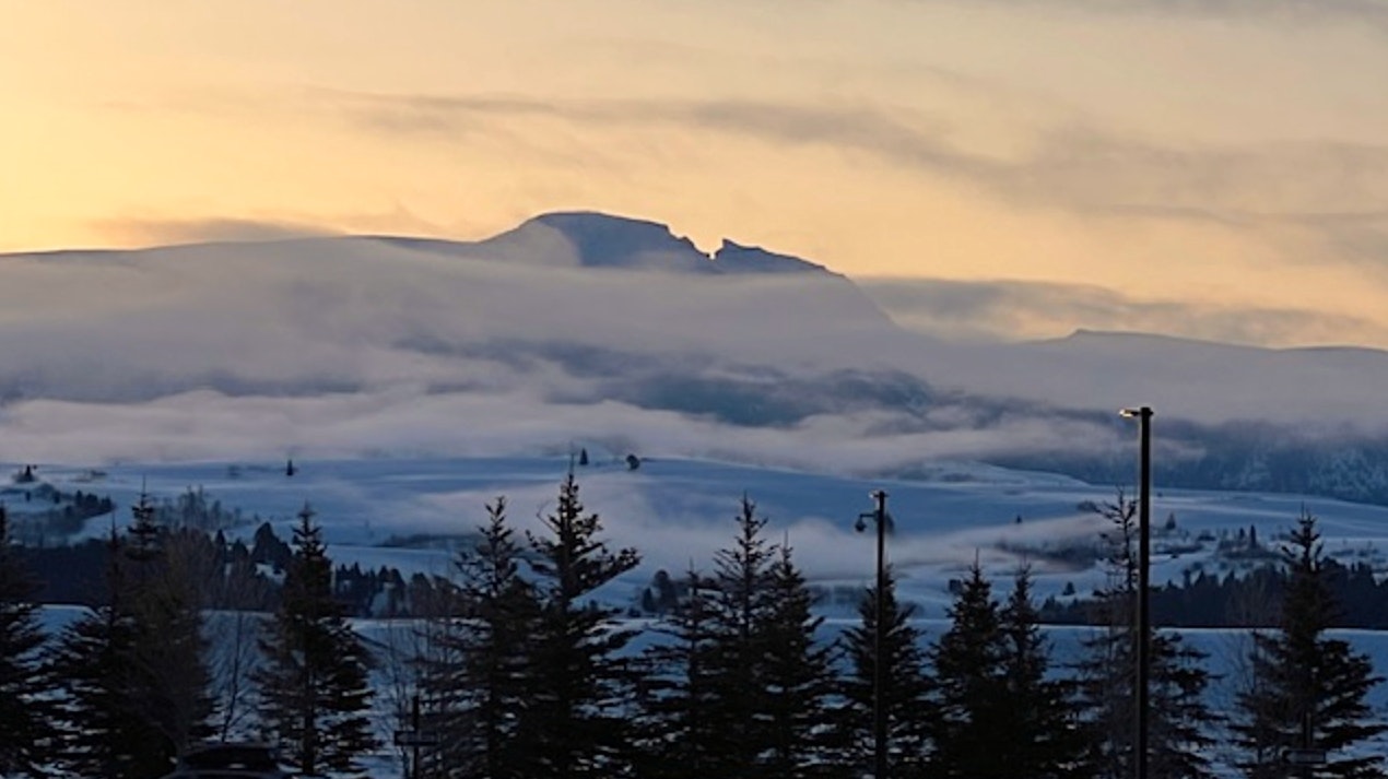 "A beautiful morning and sunrise looking at Sleeping Indian from the Jackson Hole Airport entrance."