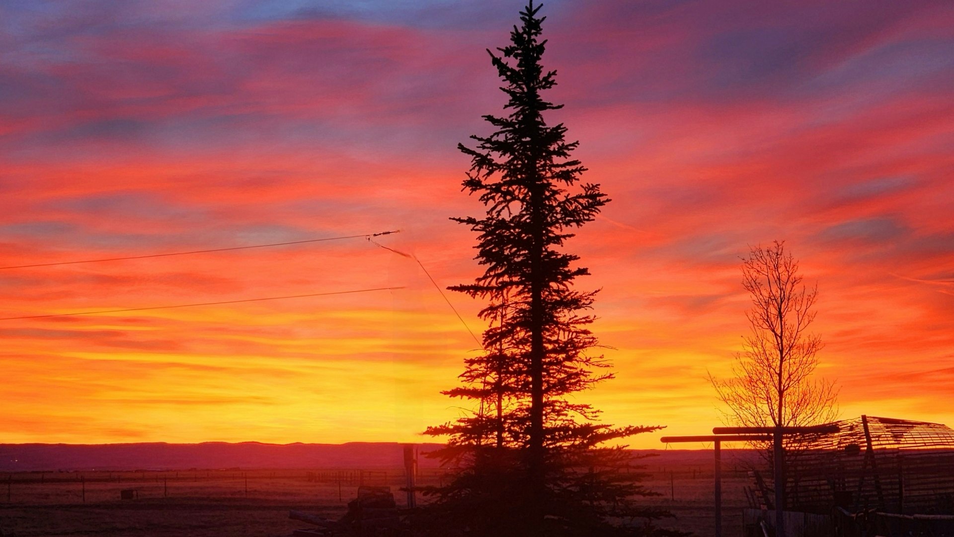 "Incredible sky colors this morning! Taken near Harmony, Wyoming."