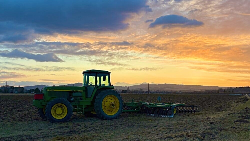 "My dog and I stopped to visit our favorite cow when this tractor and recently plowed field caught my eye. This was about 7 minutes before the sun peeked over the horizon." Cody, WY