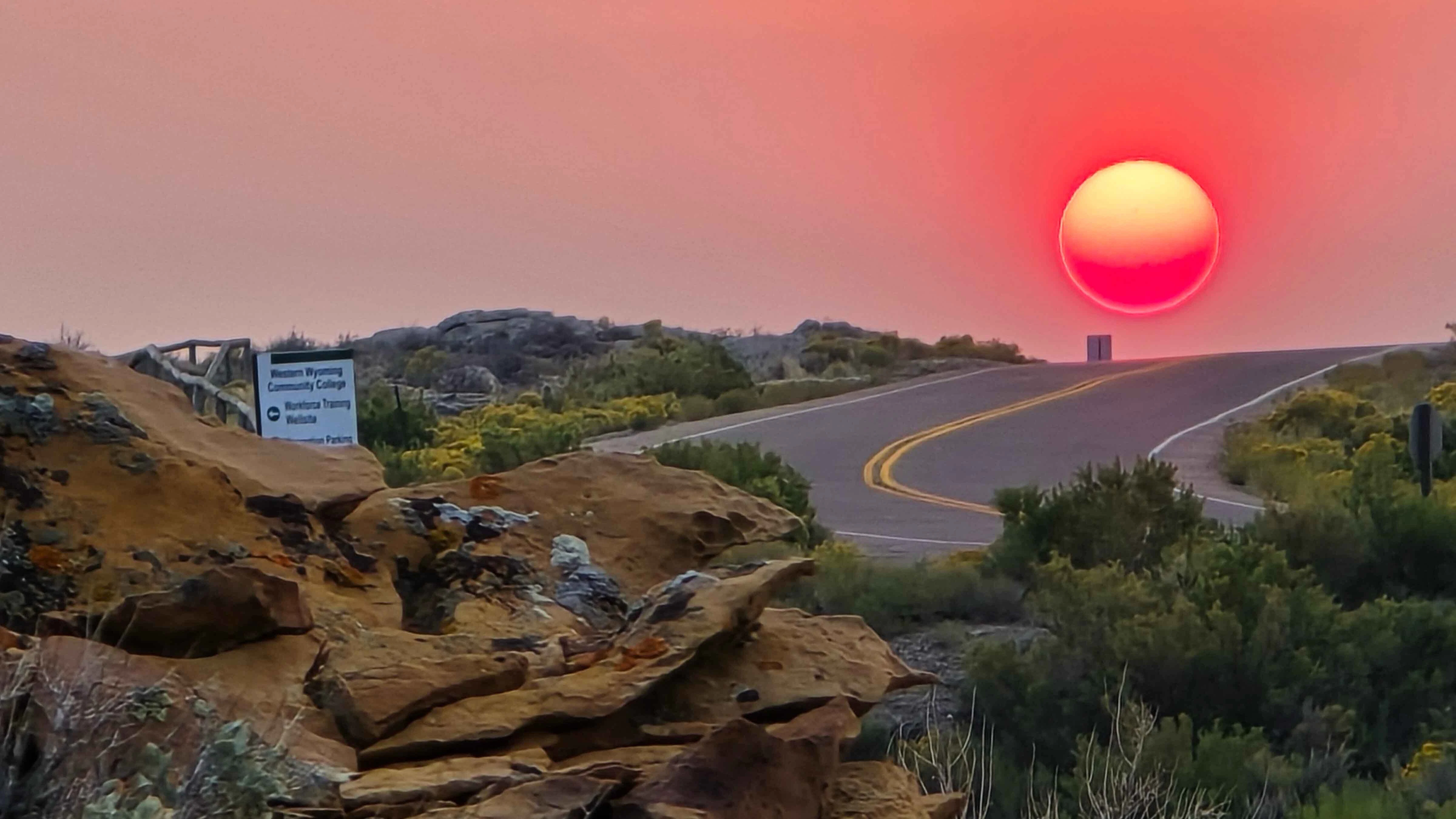 "Sunrise coming up over Skyline Drive to College Ave in Rock Springs by the hospital."