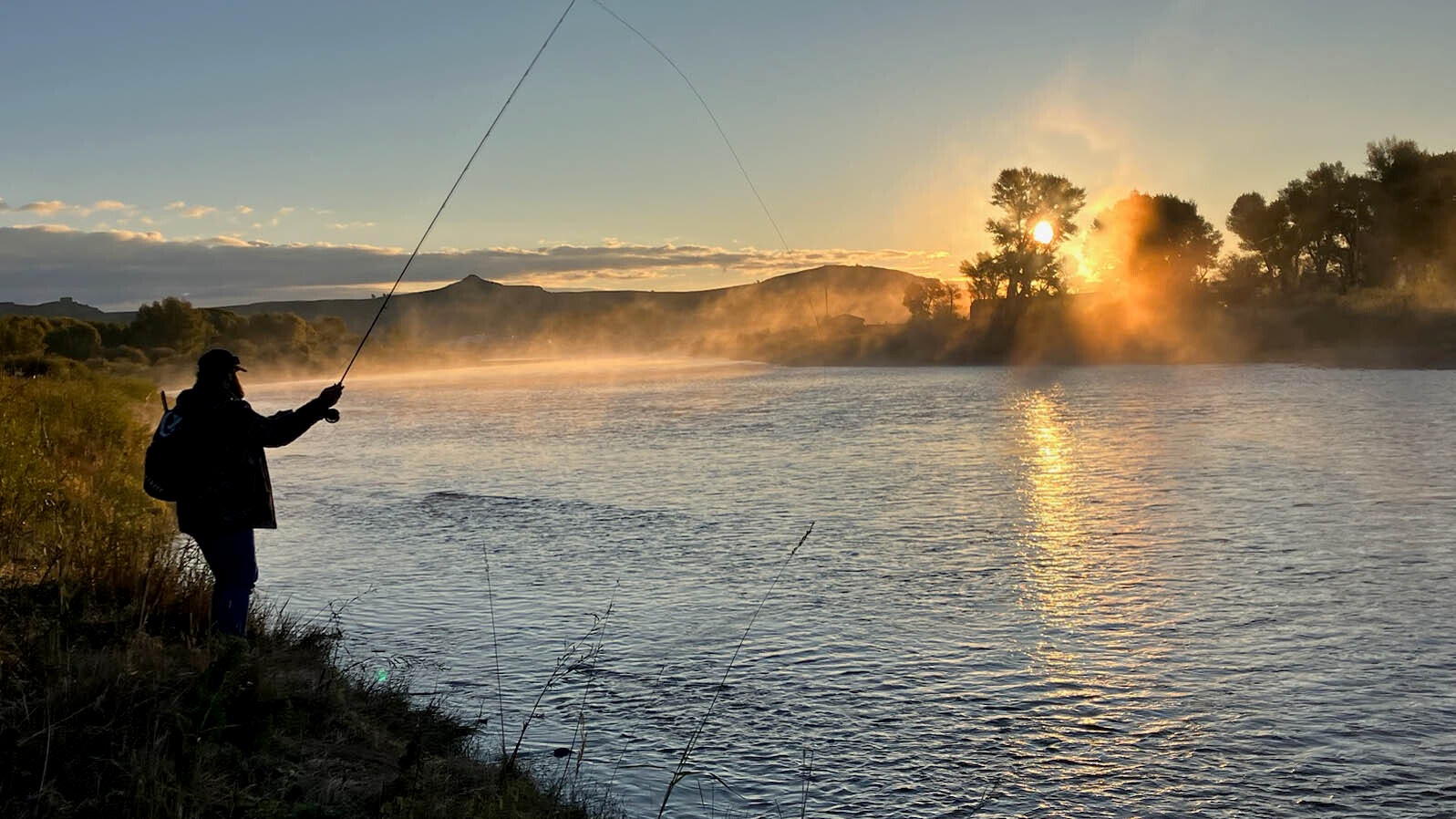 Fishing on the Green River at sunrise near Big Piney, Wyoming on Sept. 23, 2023.