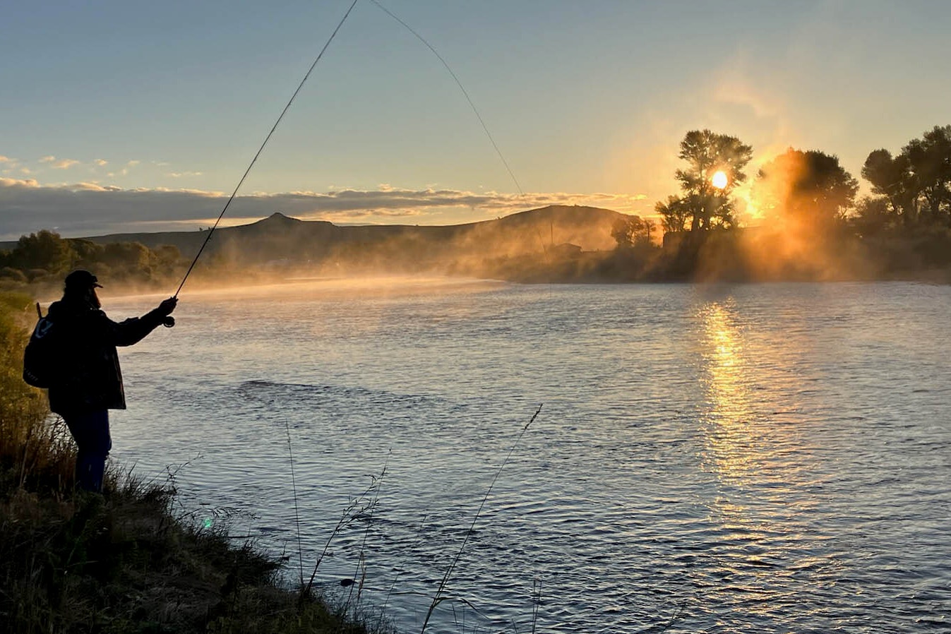 Fishing on the Green River at sunrise near Big Piney, Wyoming on Sept. 23, 2023.