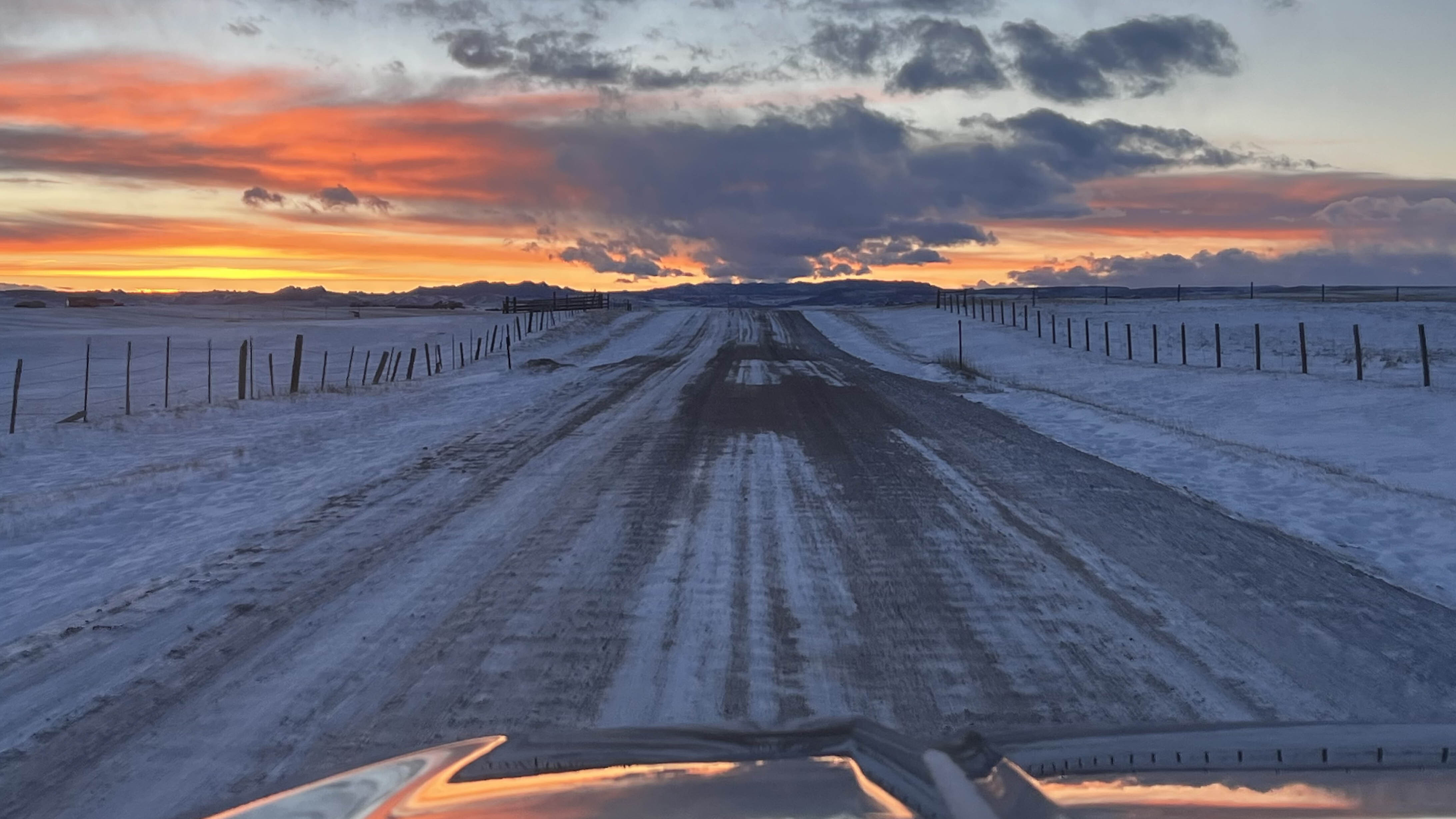 "Driving home. Wyoming never disappoints giving you a smile. West of Cheyenne."