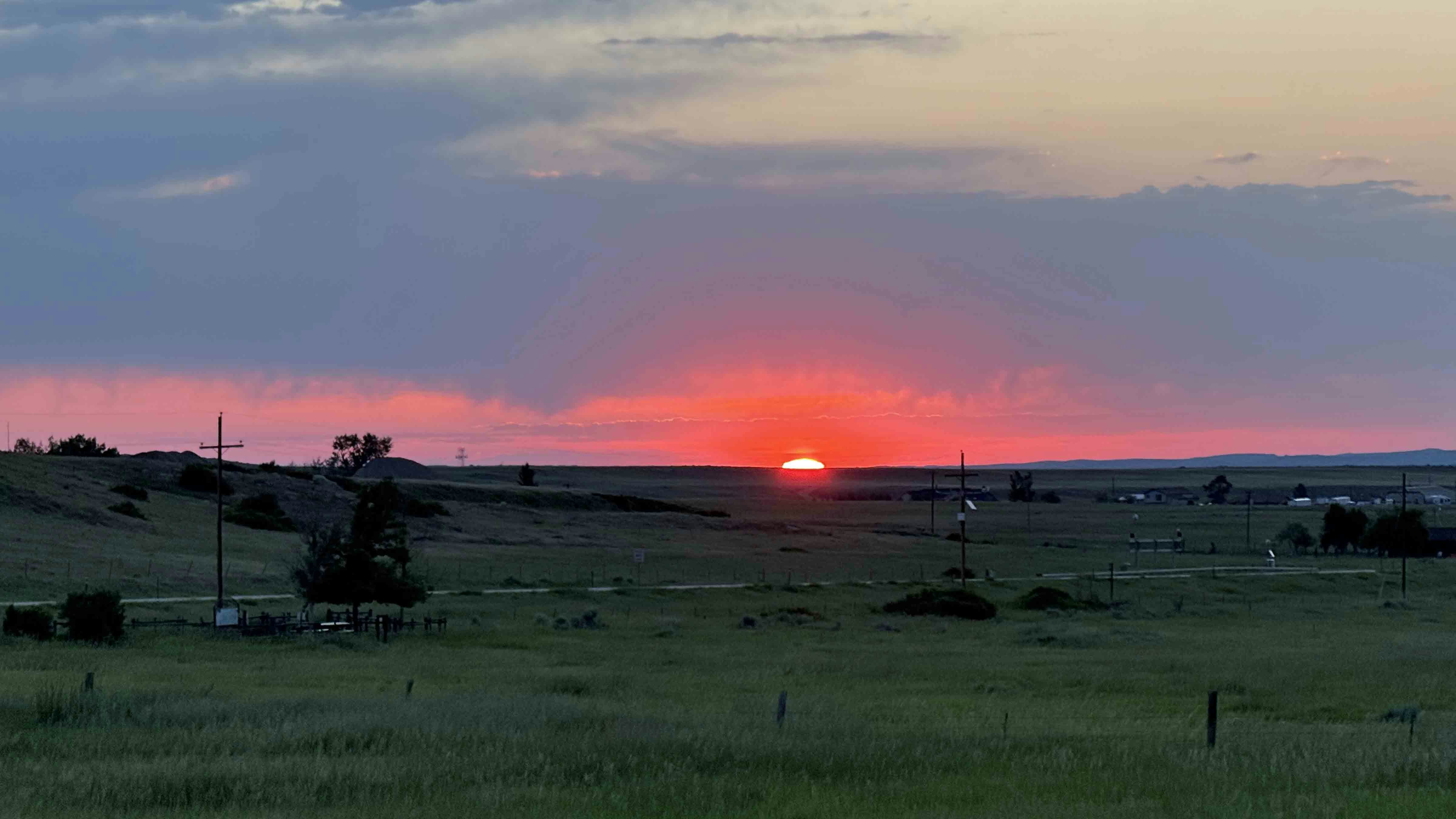 Today's Wyoming sunrise was captured by David Smith. David writes, "Beautiful start to the summer solstice as the sun peaks over its most northern point on the horizon east of Buffalo."