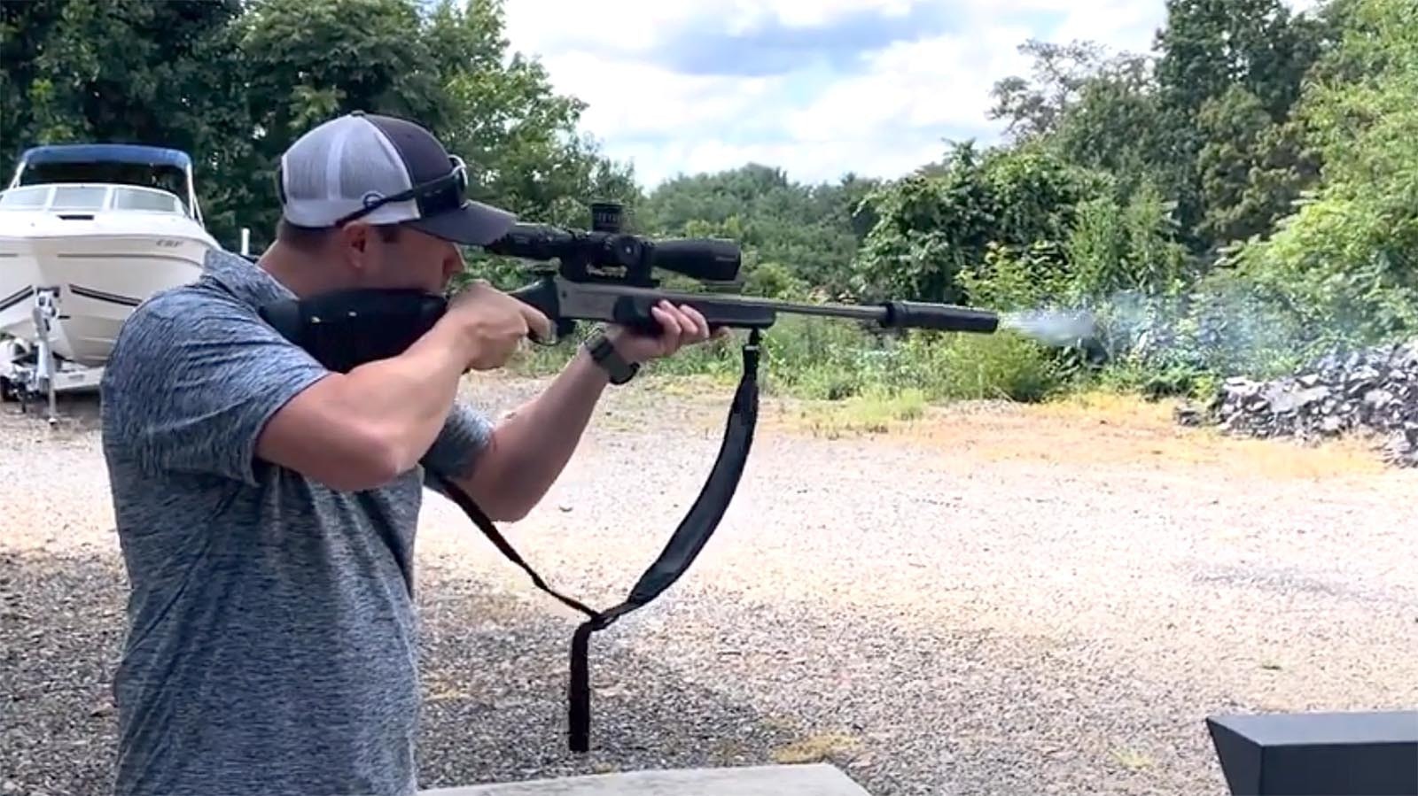 Demonstrating a suppressor attached to a Traditions 350 Legend.