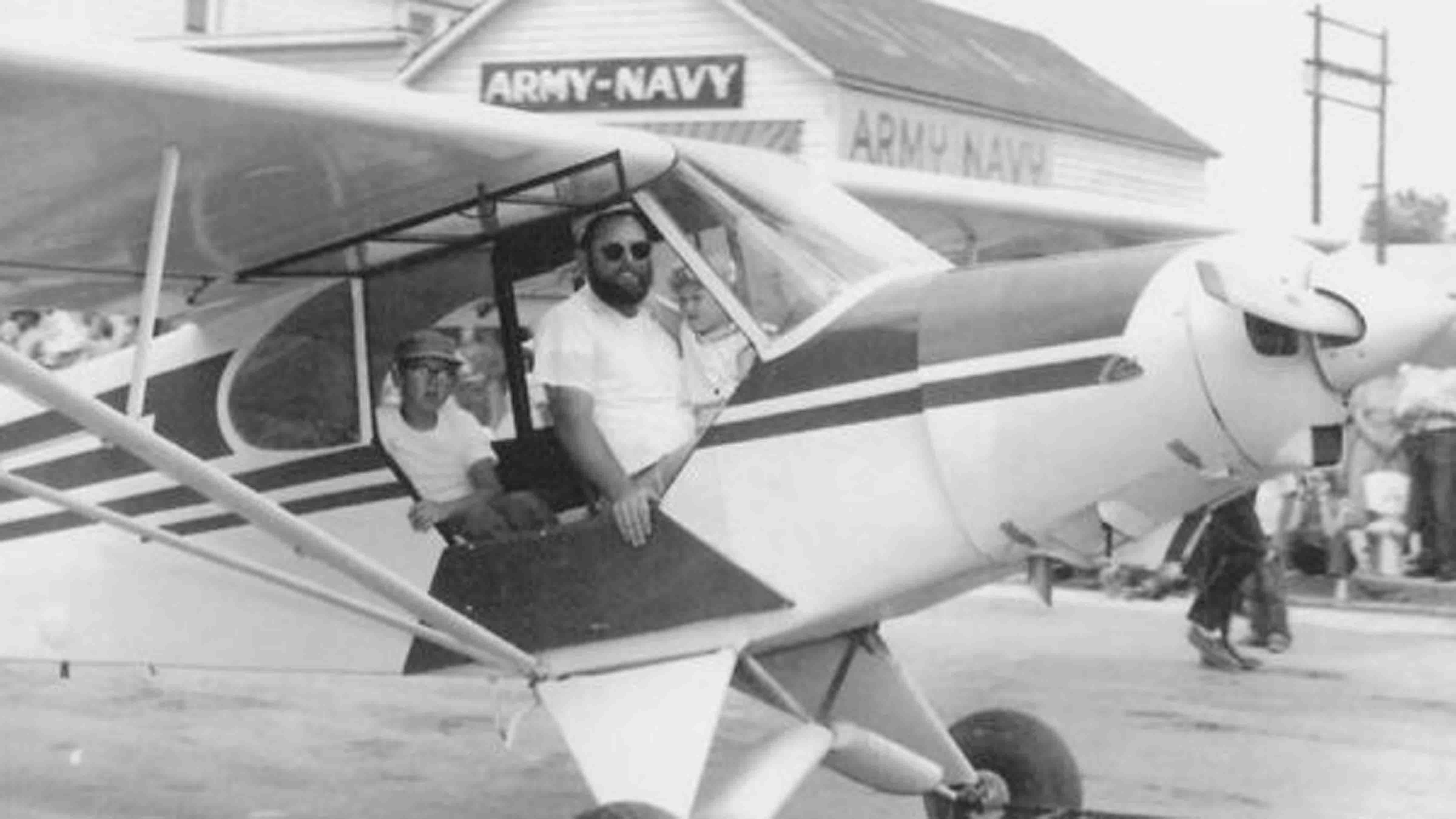 Tim Coleman and his children Kathy and Tim ride in a Piper Cub in a Riverton parade in 1955.