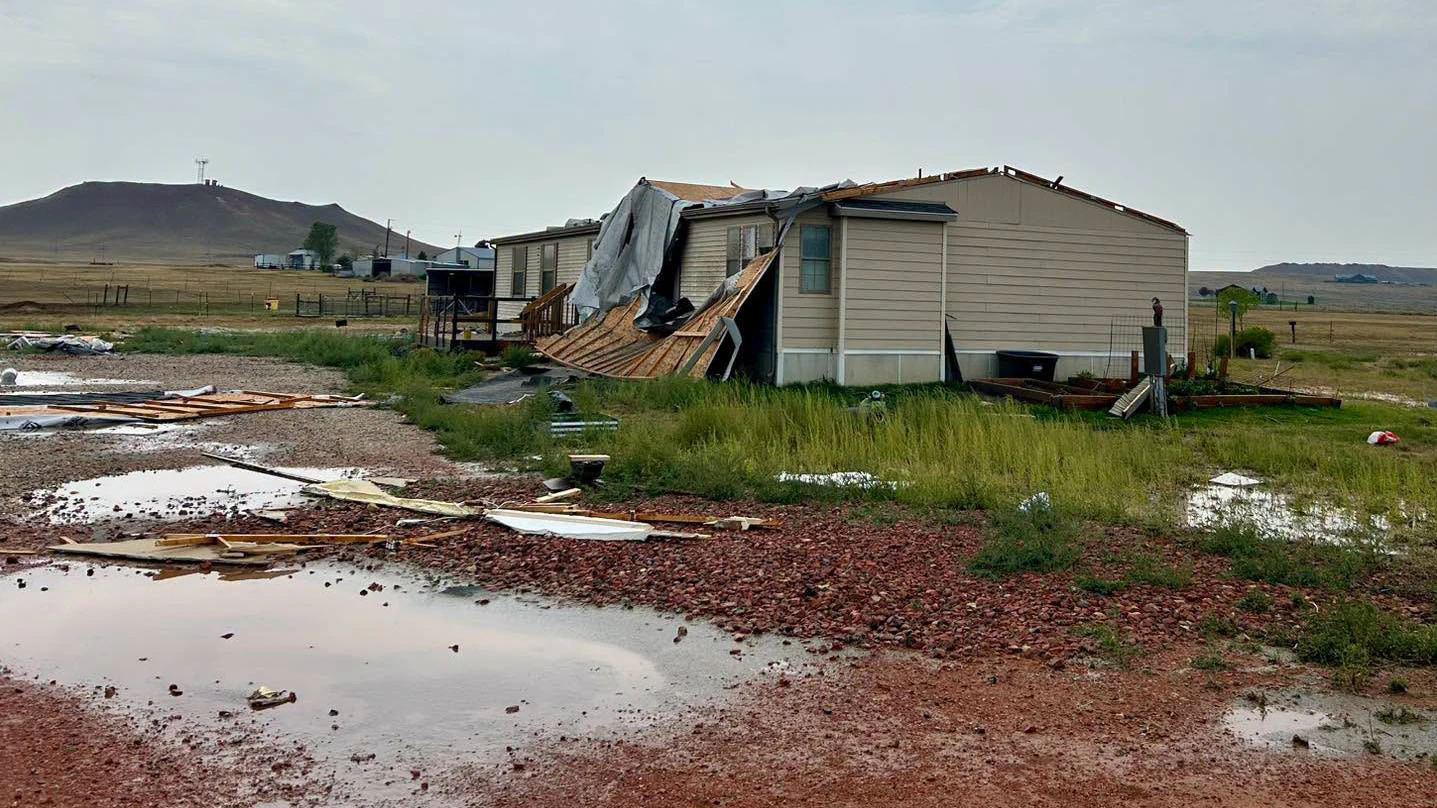 Debris is scattered across properties near South Highway 59 and Rattlesnake Road in Campbell County after a possible tornado Wednesday afternoon ripped roofs from buildings, damaged homes and overturned a camper
