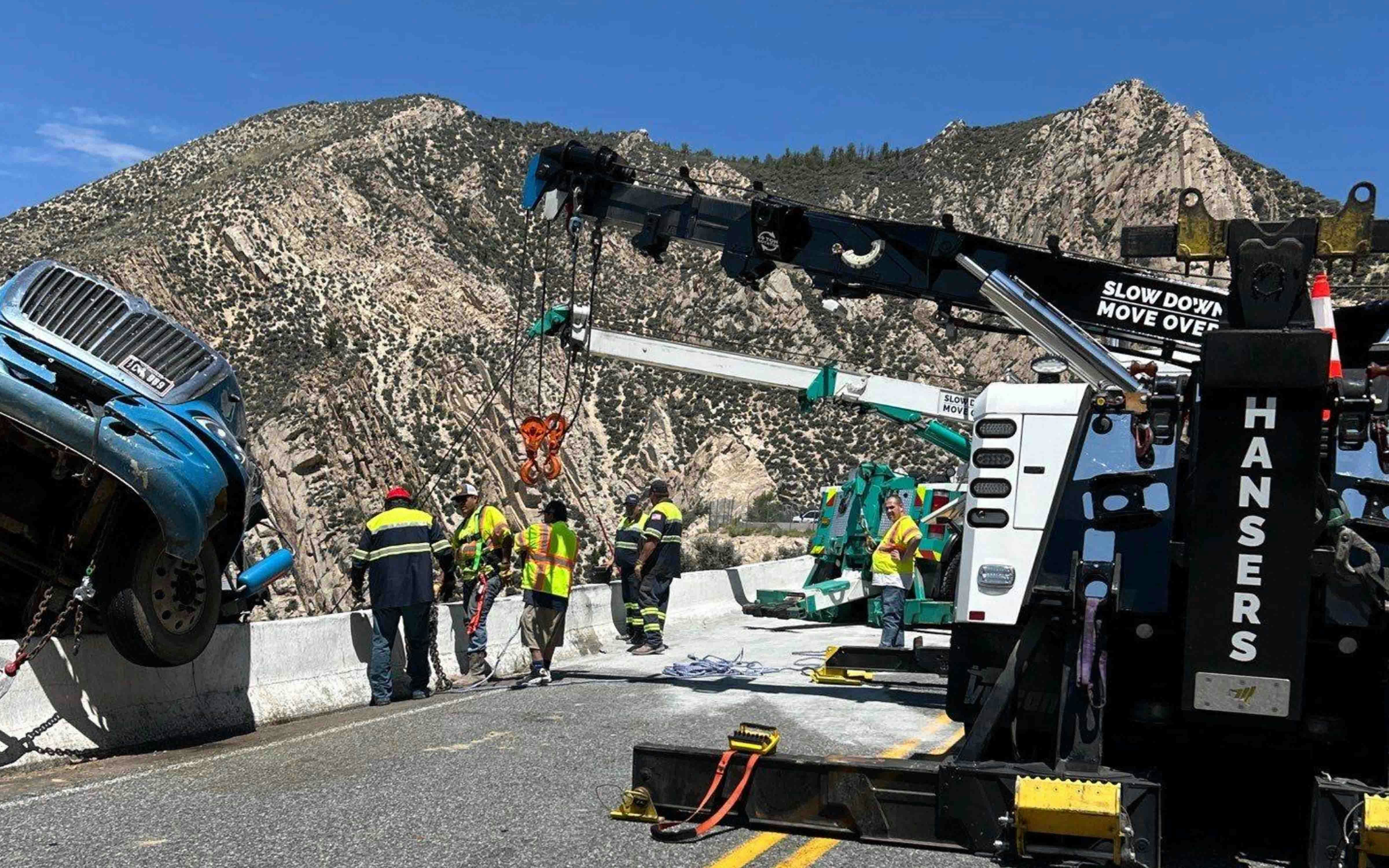 It took a Montana company three heavy-duty wrecker trucks hours to recover a semitrailer hanging over a cliff on Wyoming Highway 14A on Tuesday. The driver wasn’t hurt, but it took much more than a regular tow truck to pull the semitrailer back over the highway barrier.