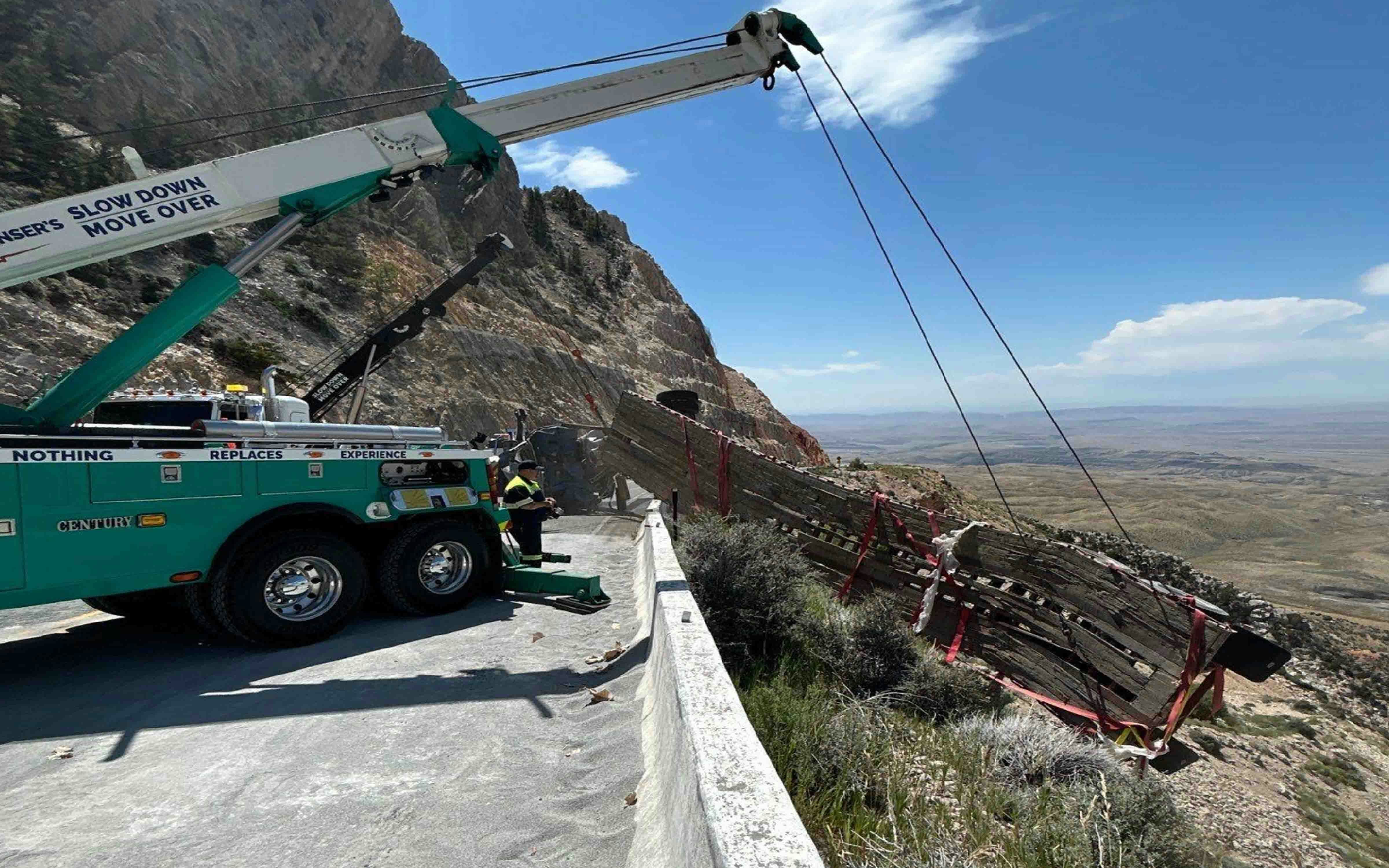 It took a Montana company three heavy-duty wrecker trucks hours to recover a semitrailer hanging over a cliff on Wyoming Highway 14A on Tuesday. The driver wasn’t hurt, but it took much more than a regular tow truck to pull the semitrailer back over the highway barrier.