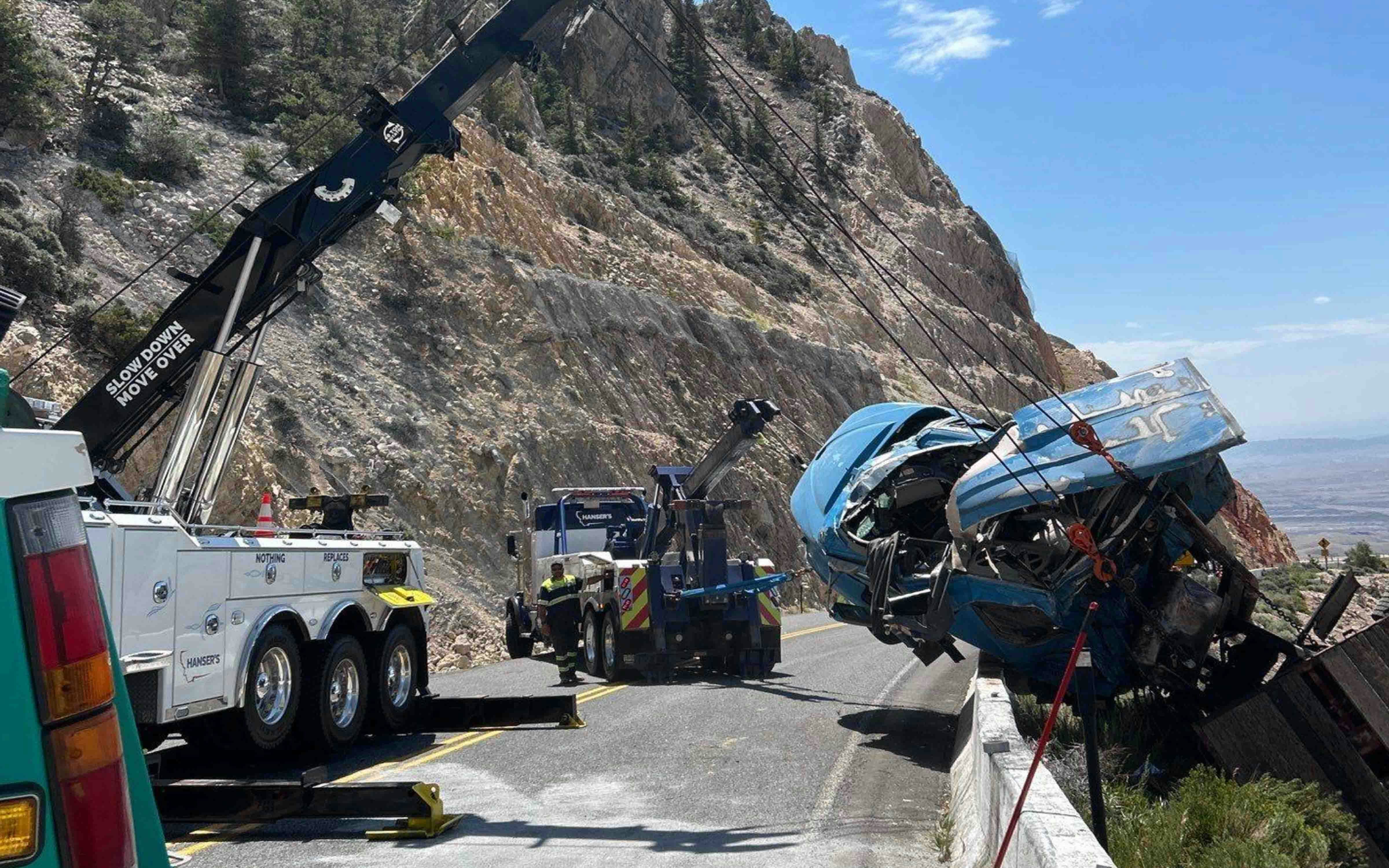 It took a Montana company three heavy-duty wrecker trucks hours to recover a semitrailer hanging over a cliff on Wyoming Highway 14A on Tuesday. The driver wasn’t hurt, but it took much more than a regular tow truck to pull the semitrailer back over the highway barrier.