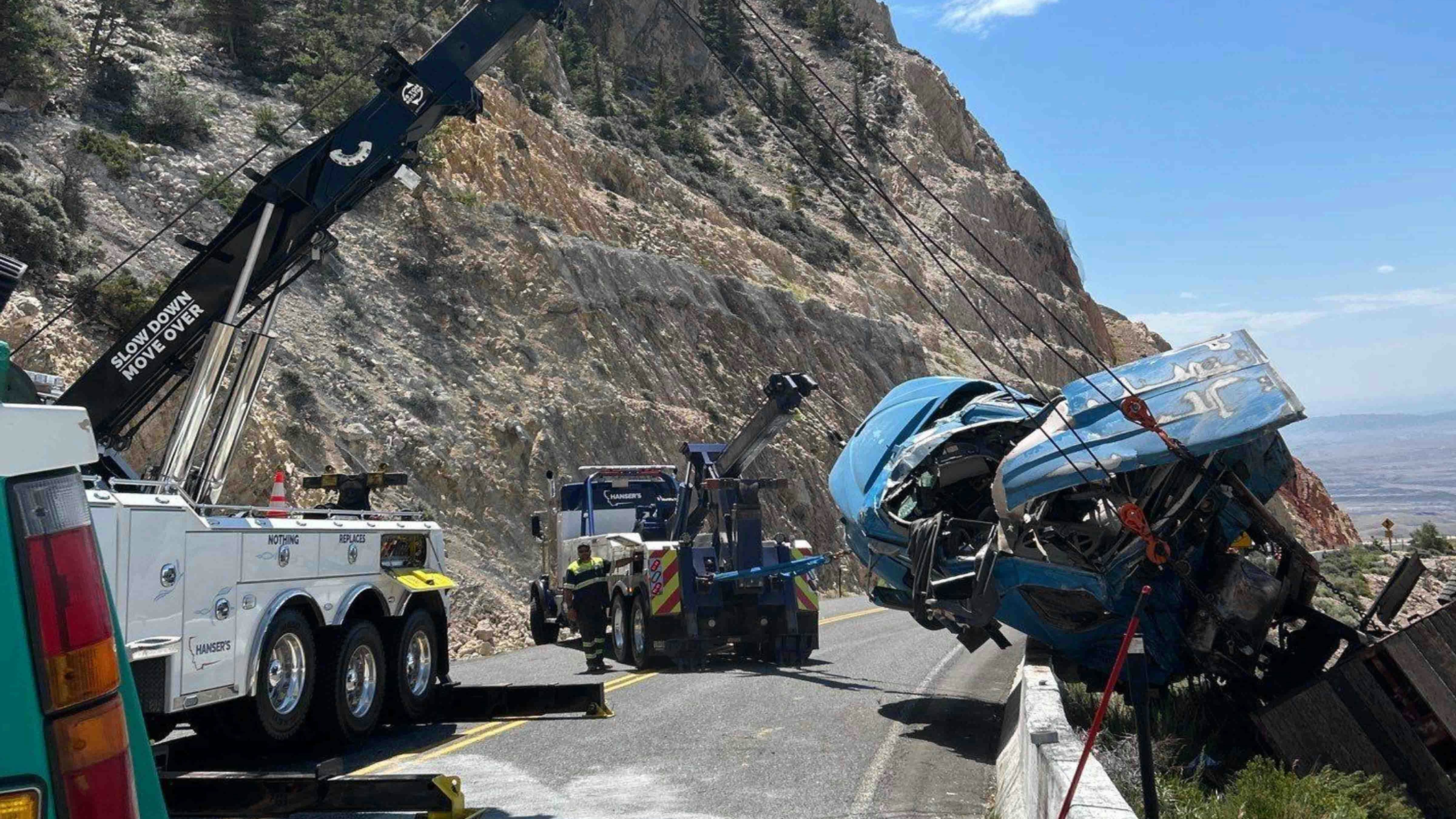 It took a Montana company three heavy-duty wrecker trucks hours to recover a semitrailer hanging over a cliff on Wyoming Highway 14A on Tuesday. The driver wasn’t hurt, but it took much more than a regular tow truck to pull the semitrailer back over the highway barrier.