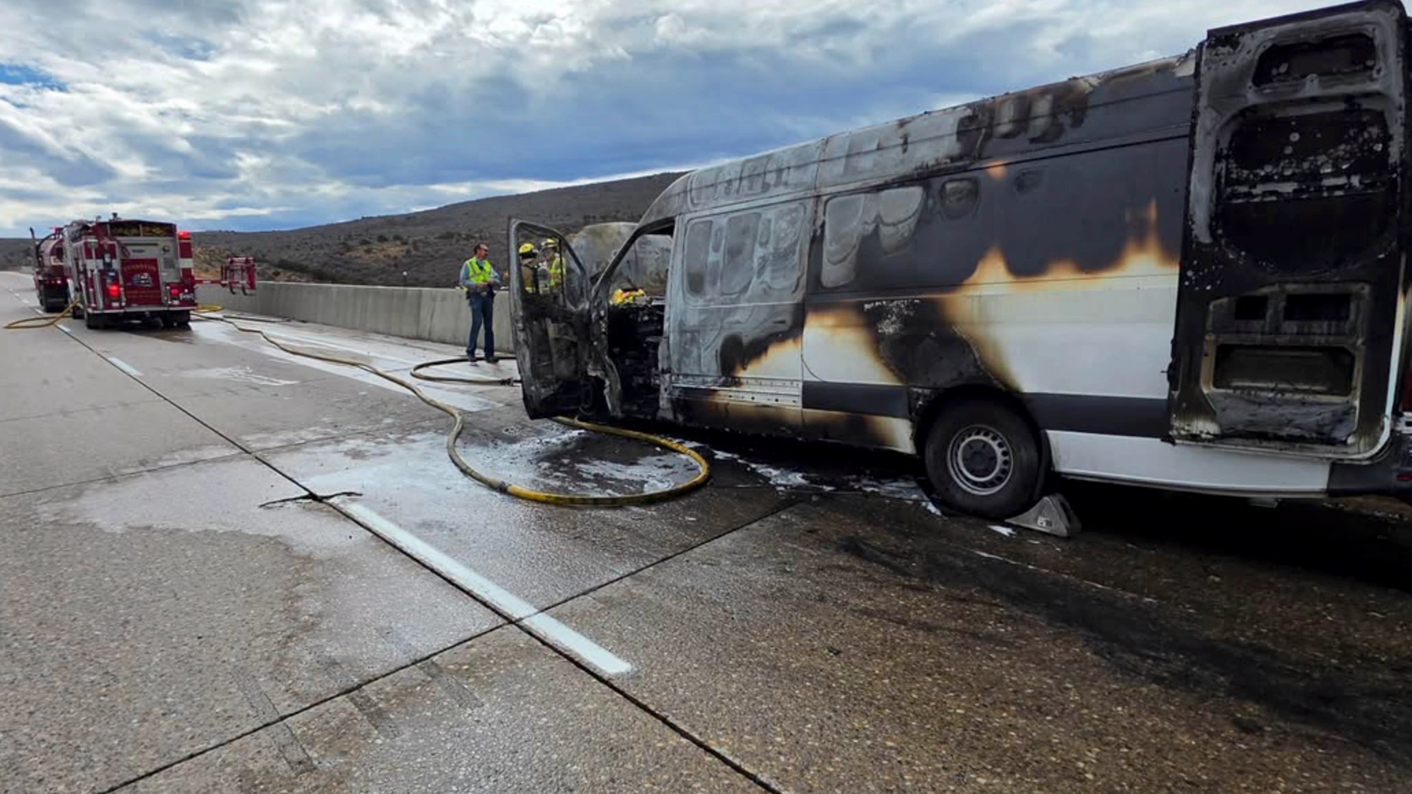 A Mercedes cargo van sits charred along eastbound Interstate 80 near milepost 20 east of Evanston on Thursday after catching fire