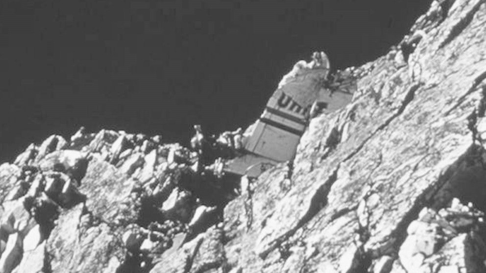 United Airlines Flight 409 hit Medicine Bow Peak only a few feet below the top, and left the tail section lodged in the mountain face.