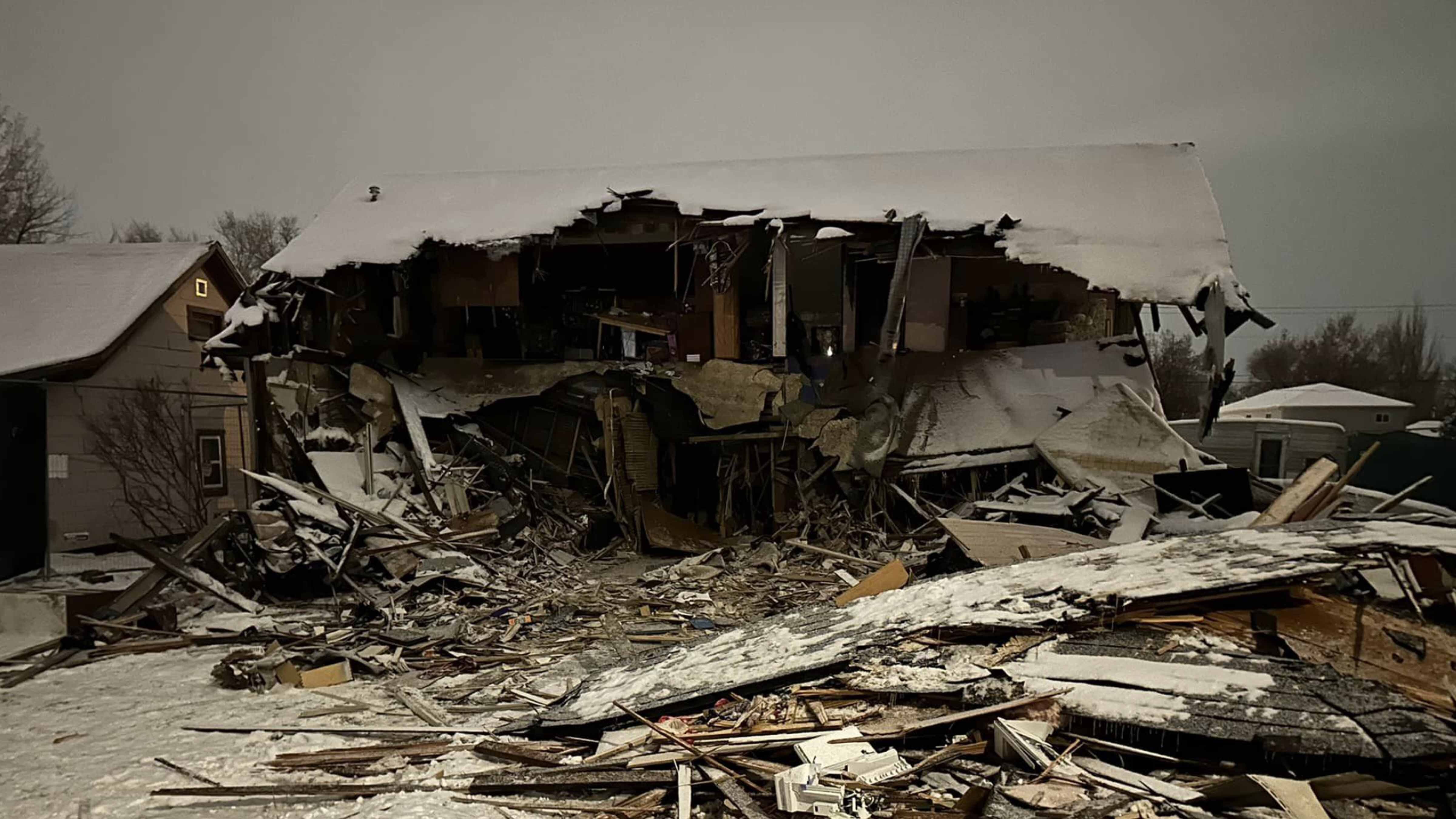 After a 32-hour standoff between law enforcement and a man suspected of killing a local police officer, the Sheridan home he barricaded himself in shows the extensive damage done to it during attempts to get to the suspect.